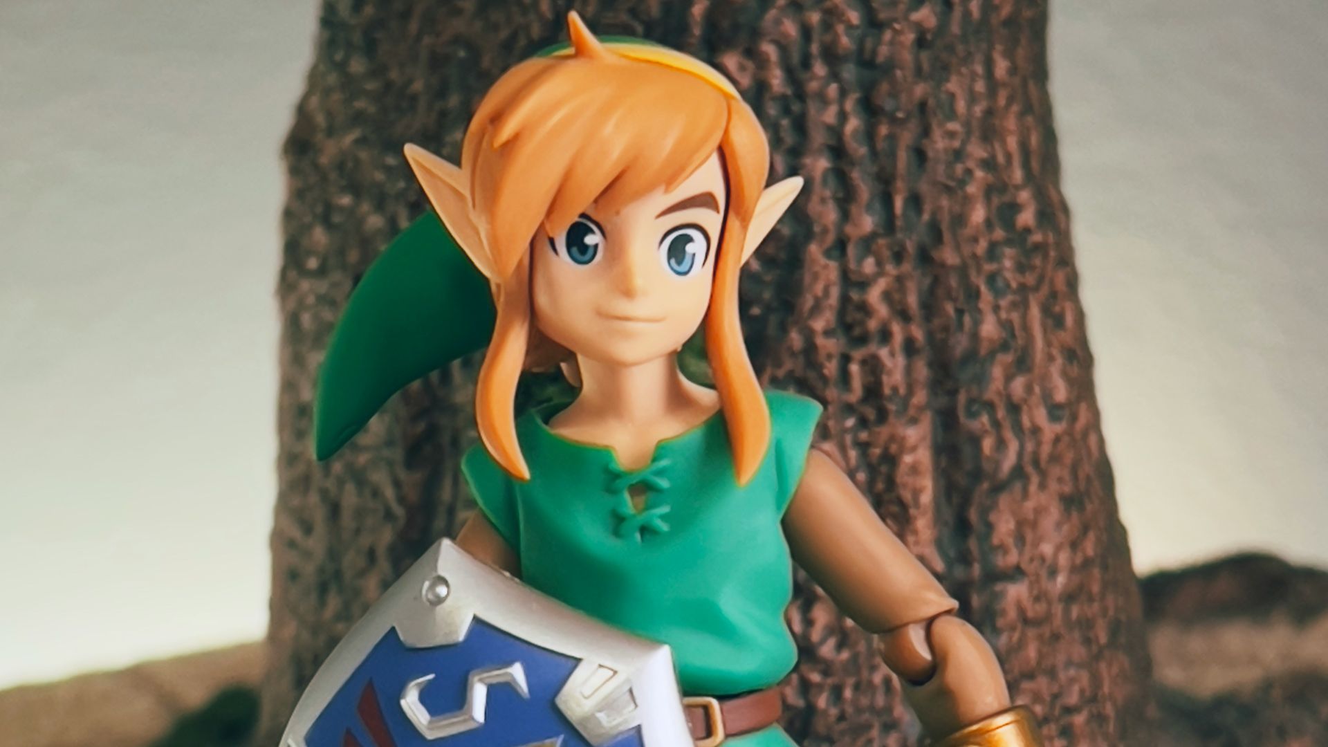 a toy girl holding a sign