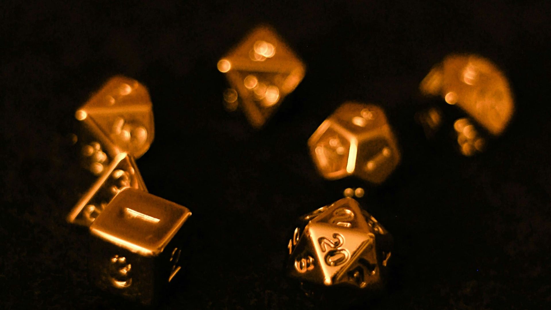 a group of gold dices sitting on top of a table
