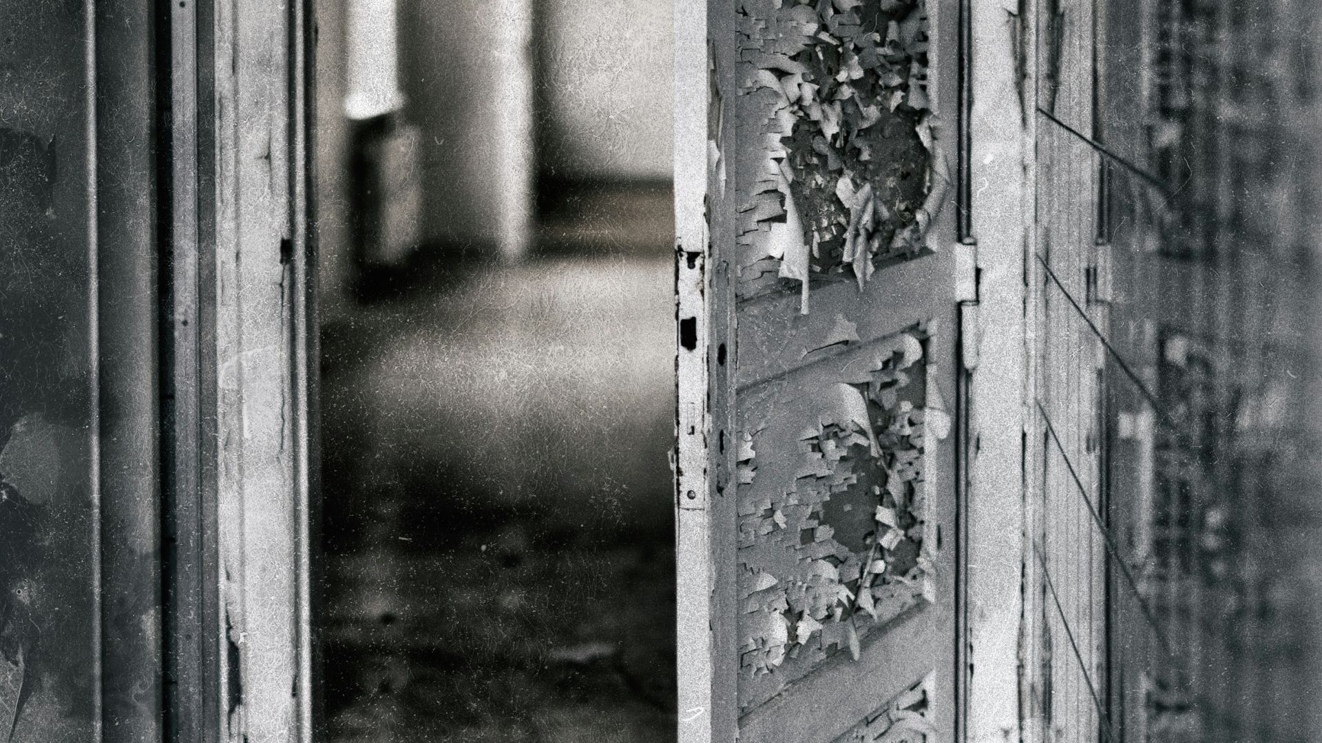 grayscale photography of opened door