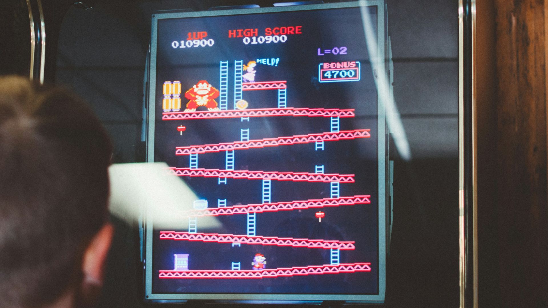 boy playing donkey kong arcade box