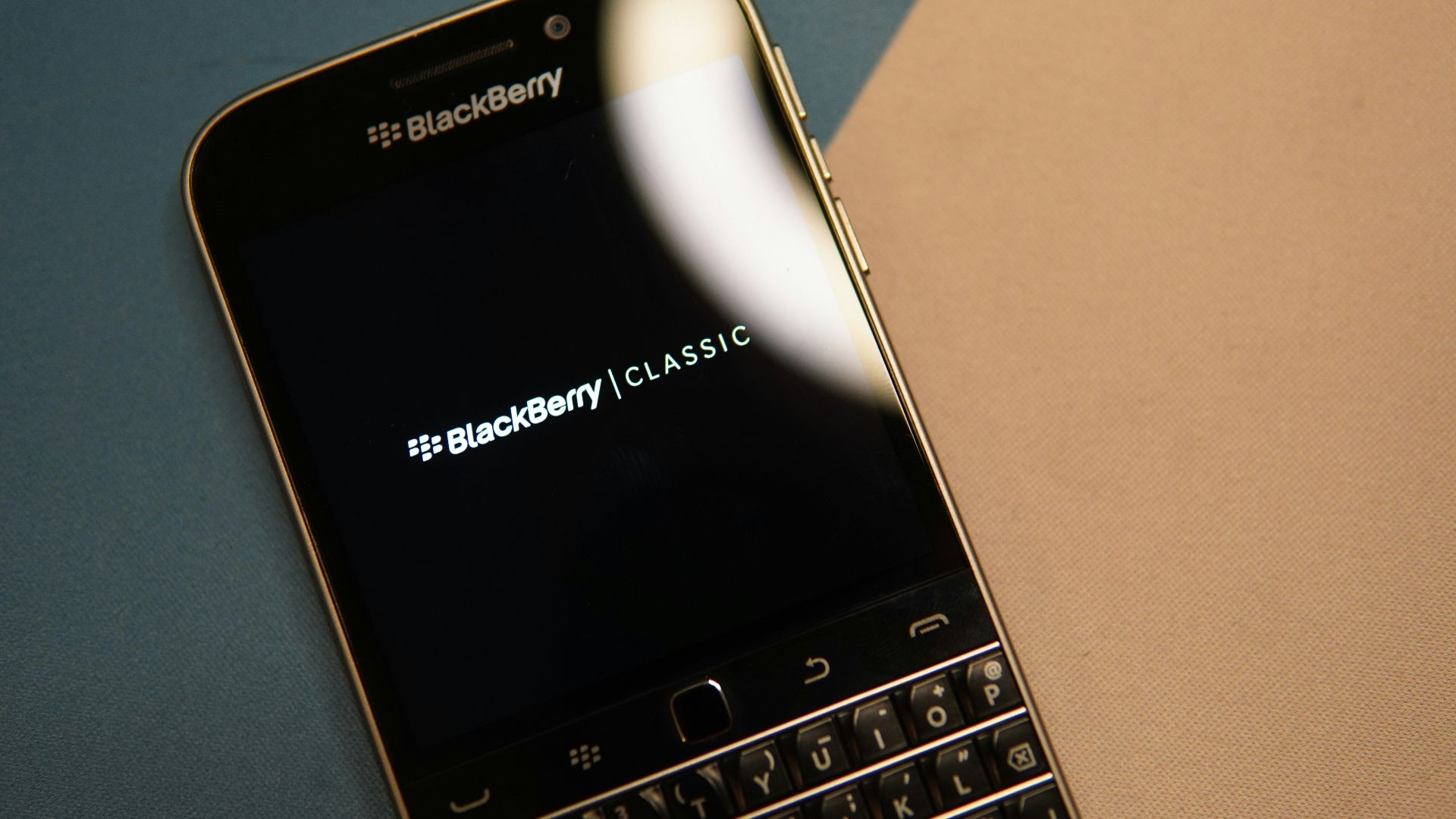 black and silver blackberry qwerty phone