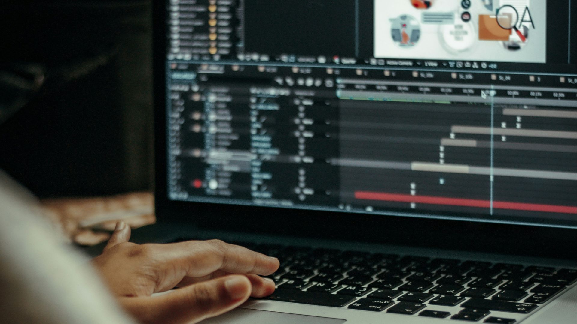 person using macbook pro on table