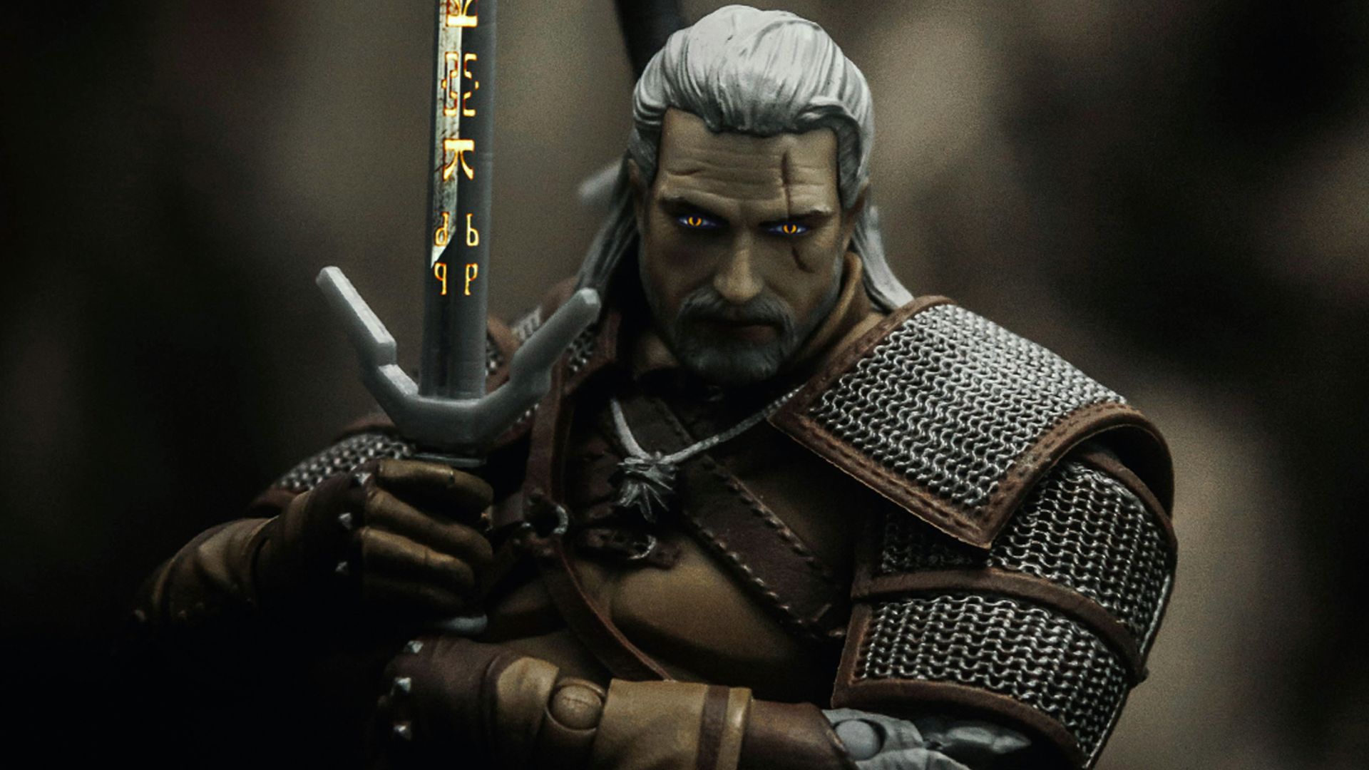 man in black and brown suit holding sword