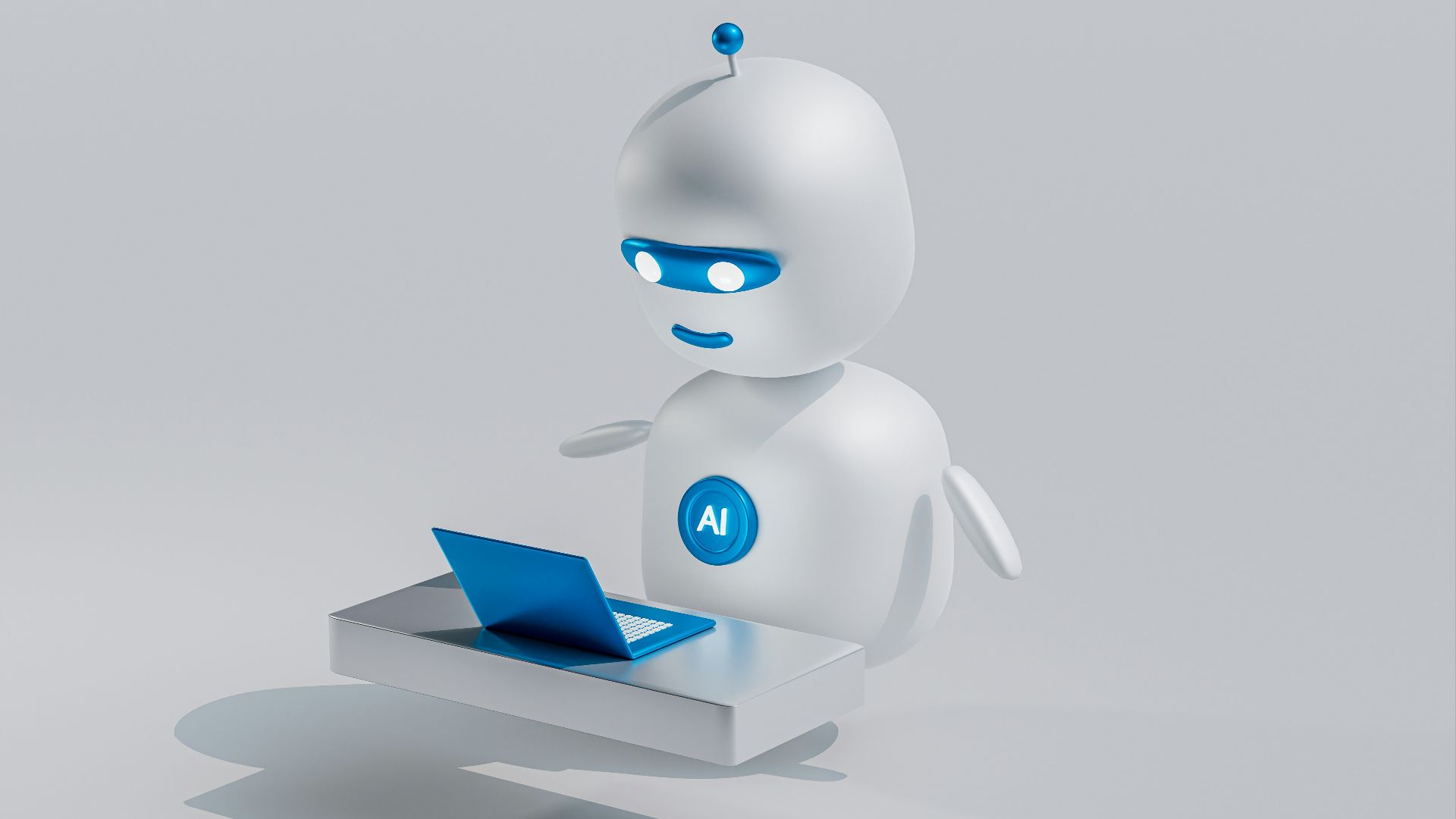 a white robot with blue eyes and a laptop