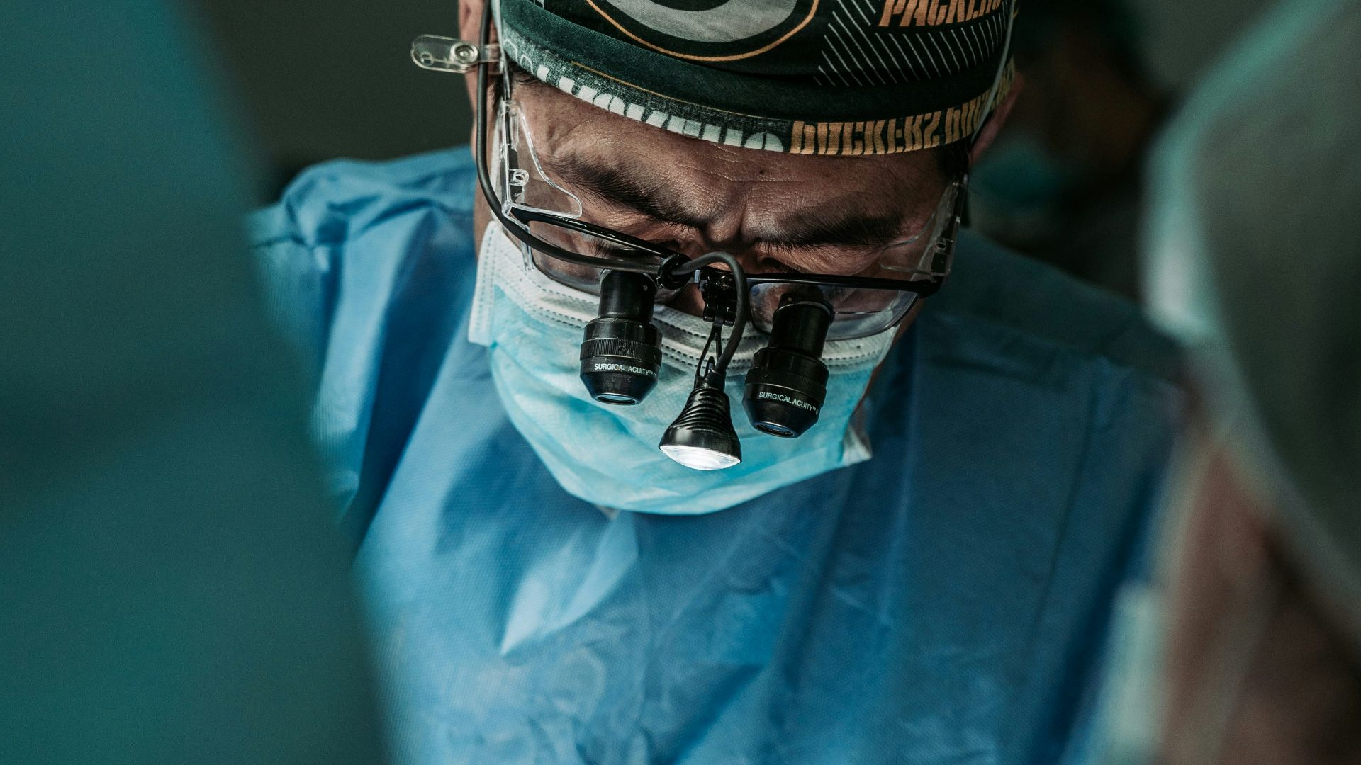 doctor wearing Green Bay Packers hat