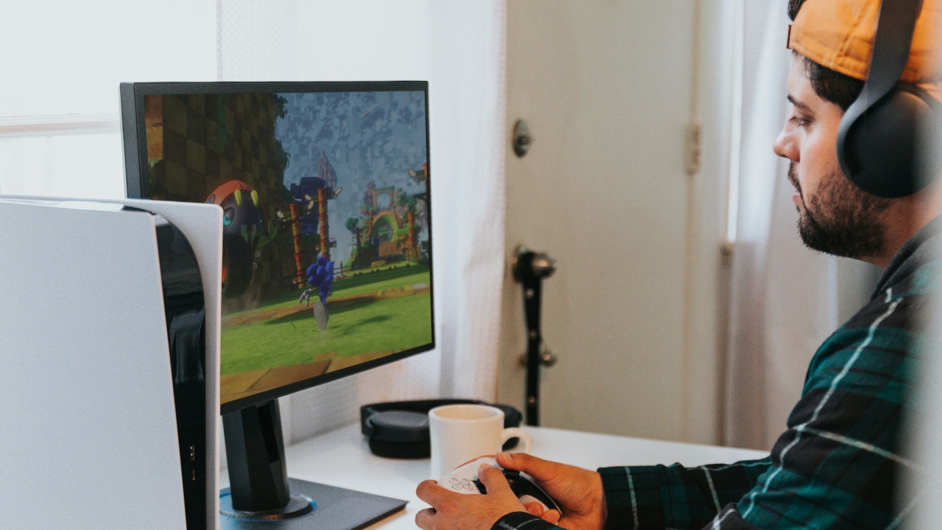 a person wearing a mask and sitting at a desk