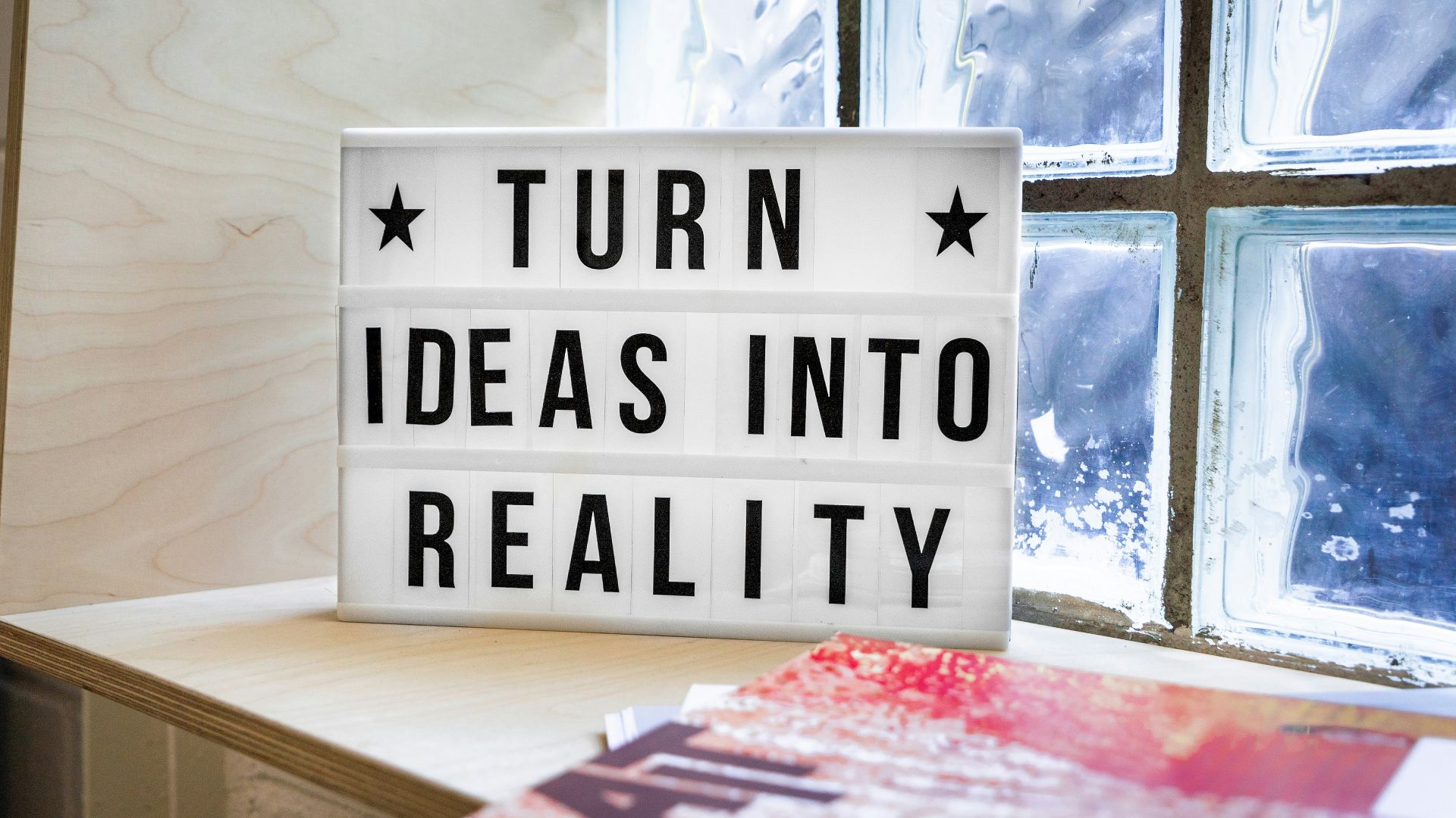 white and black wooden quote board