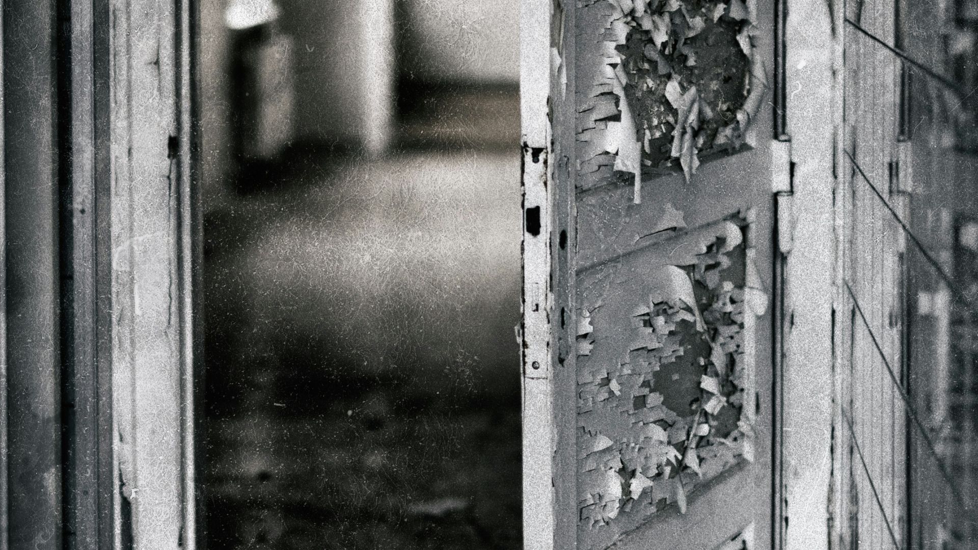 grayscale photography of opened door