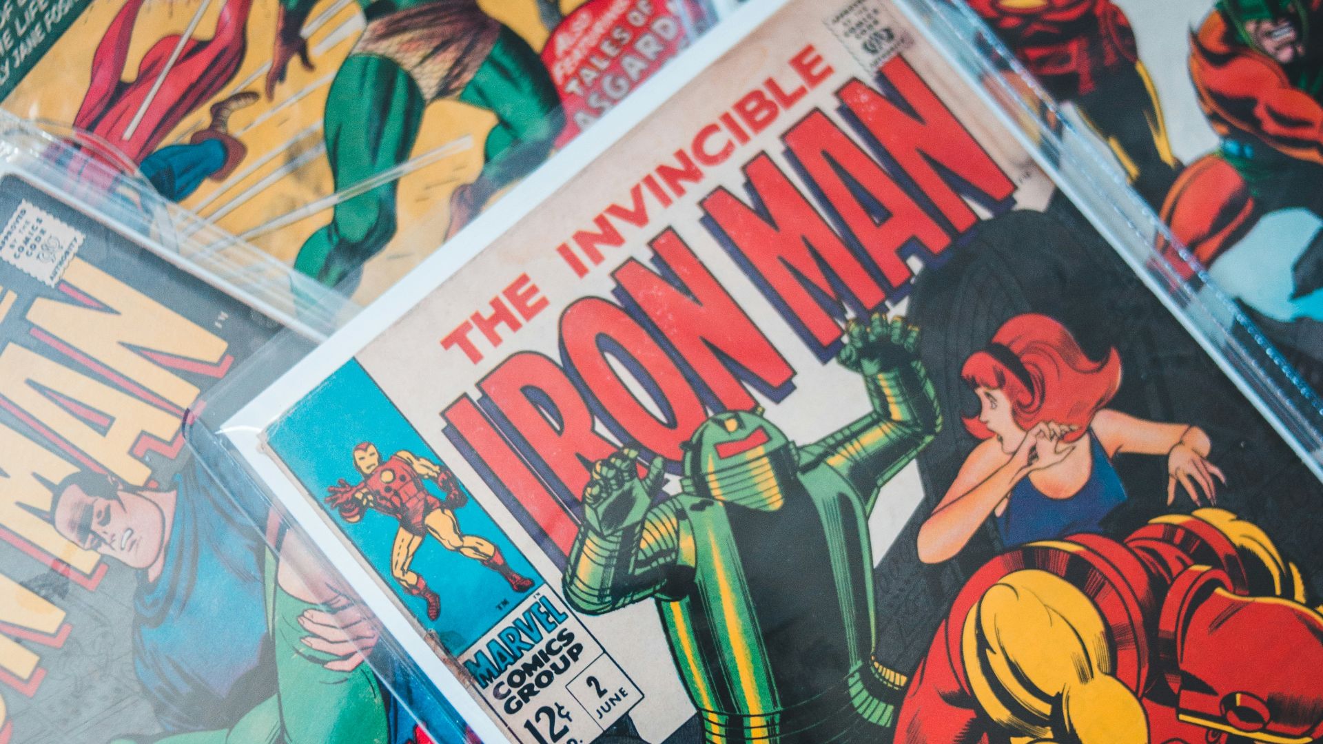 a pile of comics sitting on top of a table