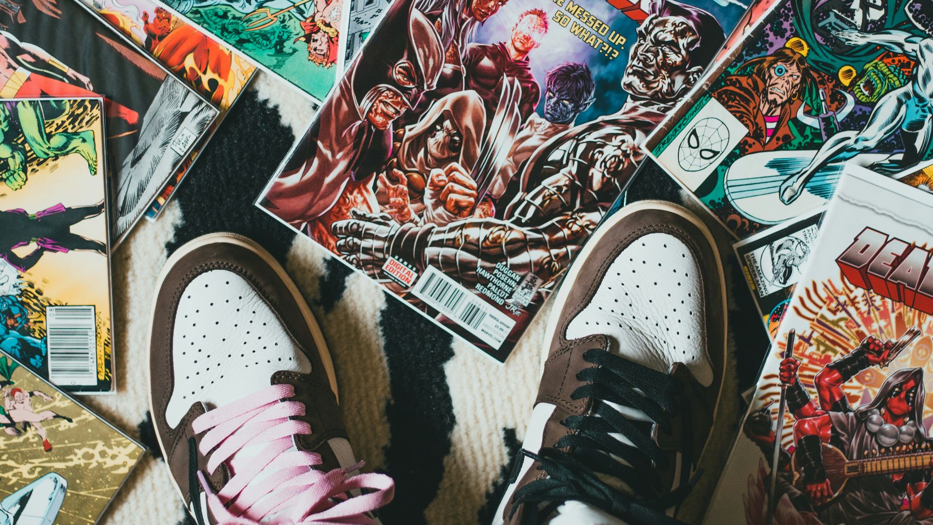 person wearing black and white sneakers