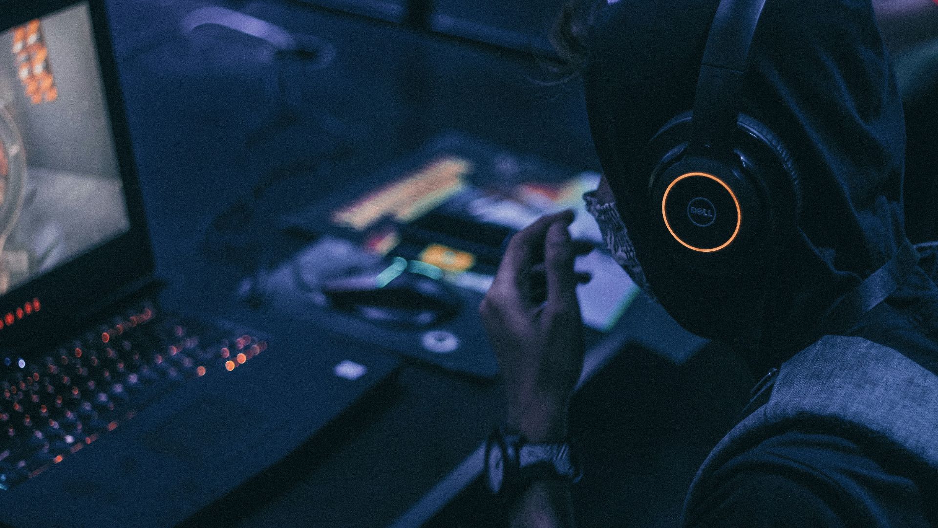 man playing on gaming lapto p