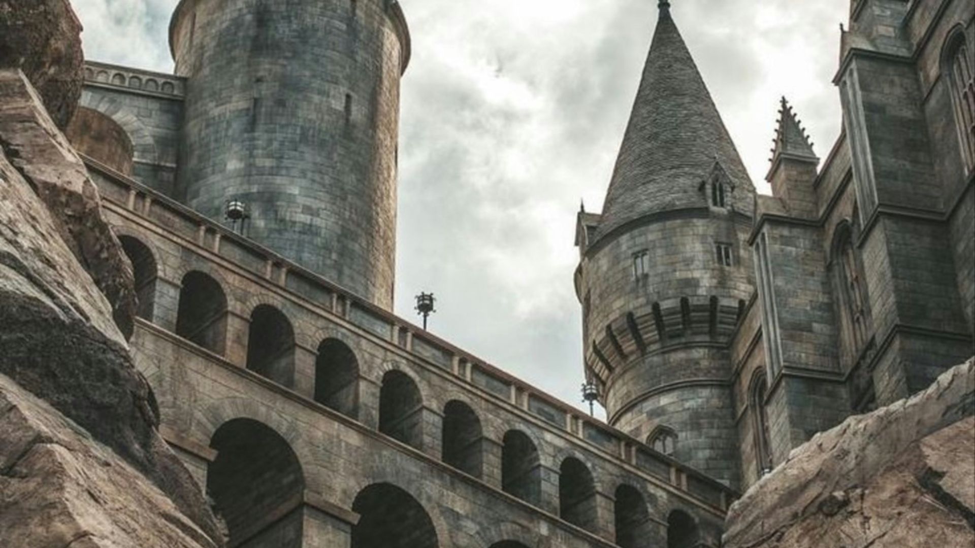 white clouds hovering above grey castle