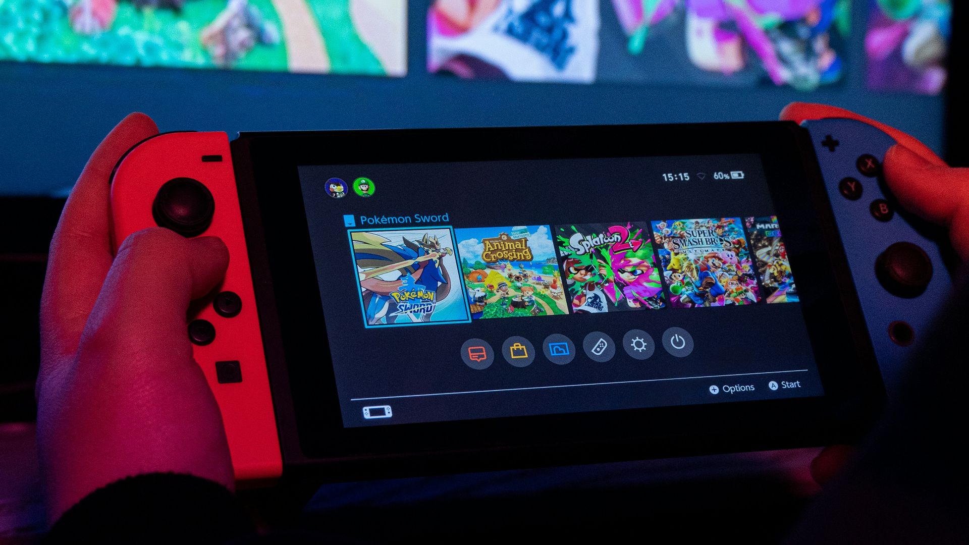 a person holding a nintendo wii game controller