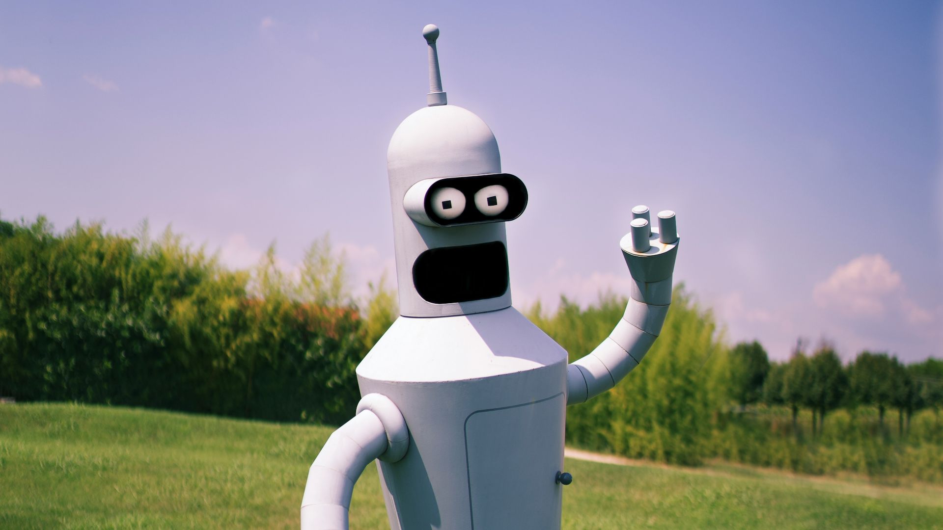 white robot on green grass field during daytime