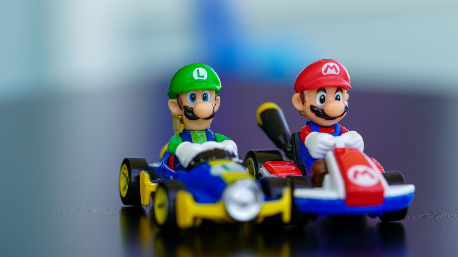 lego mini figure riding blue and red toy car