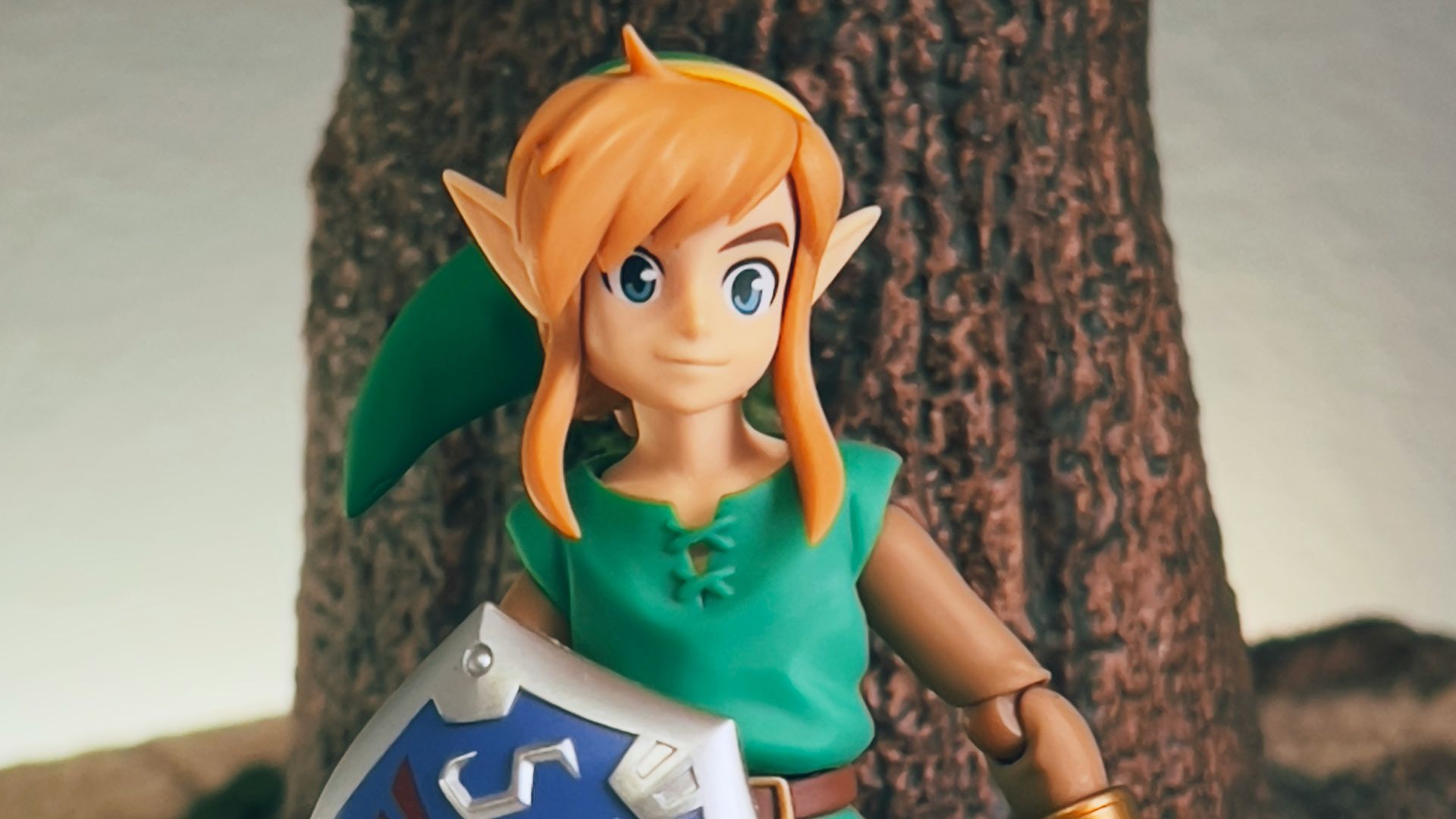 a toy girl holding a sign