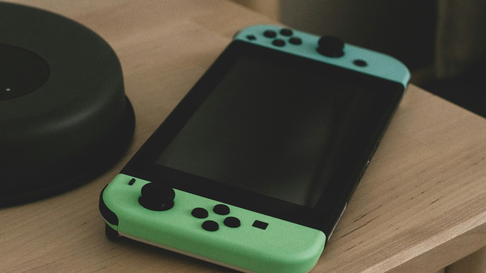 a green handheld gaming device