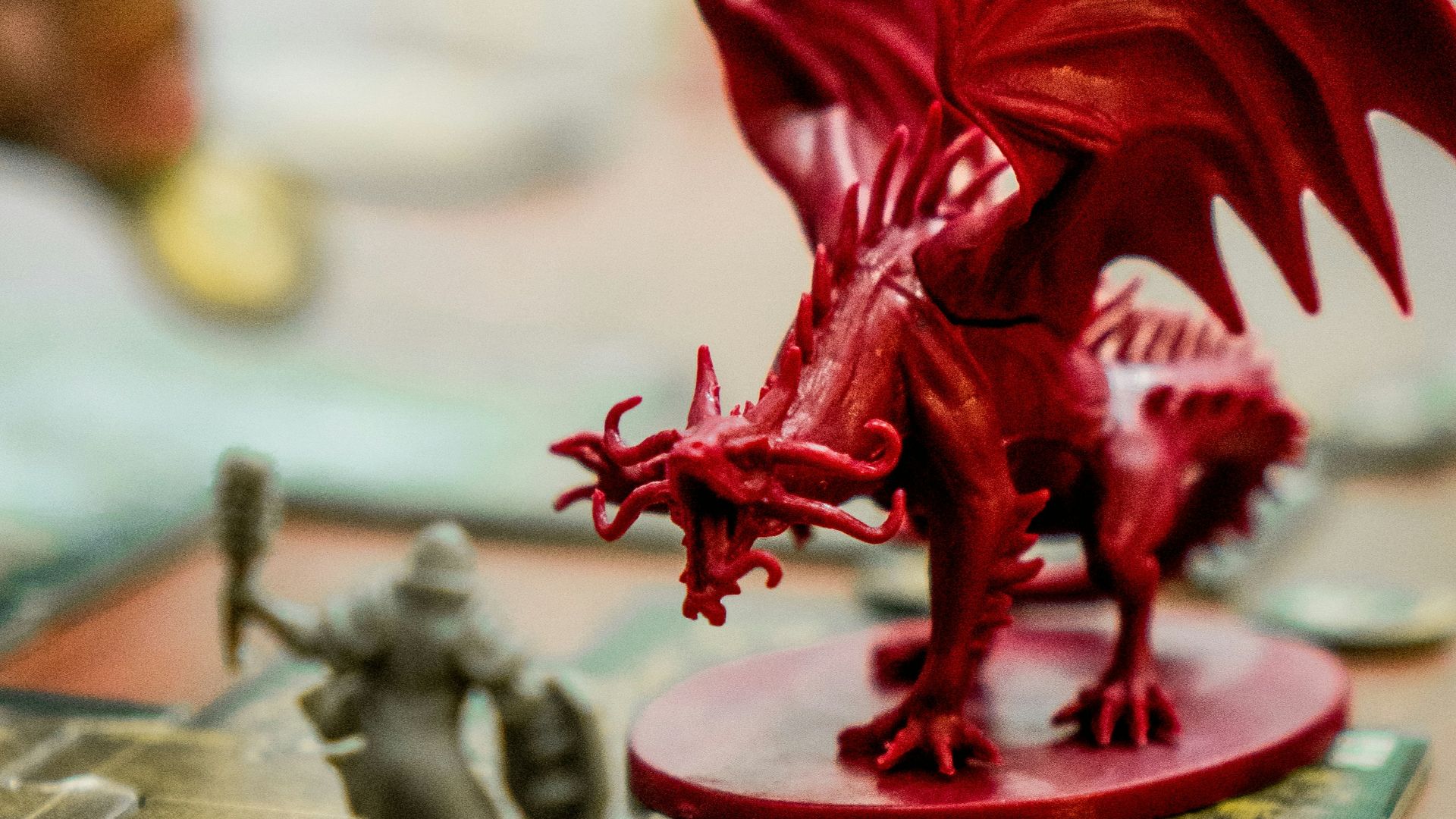 red dragon action figure on table
