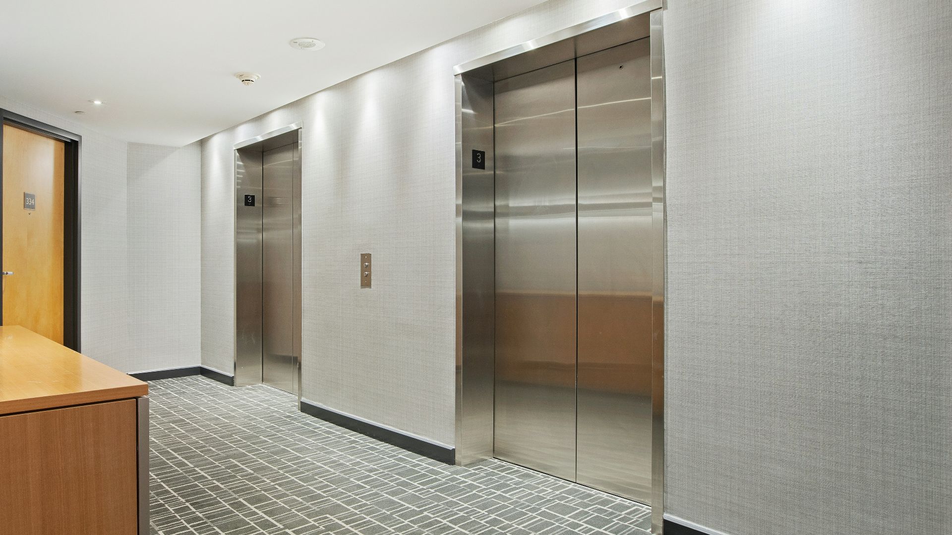 brown wooden cabinet near brown wooden door