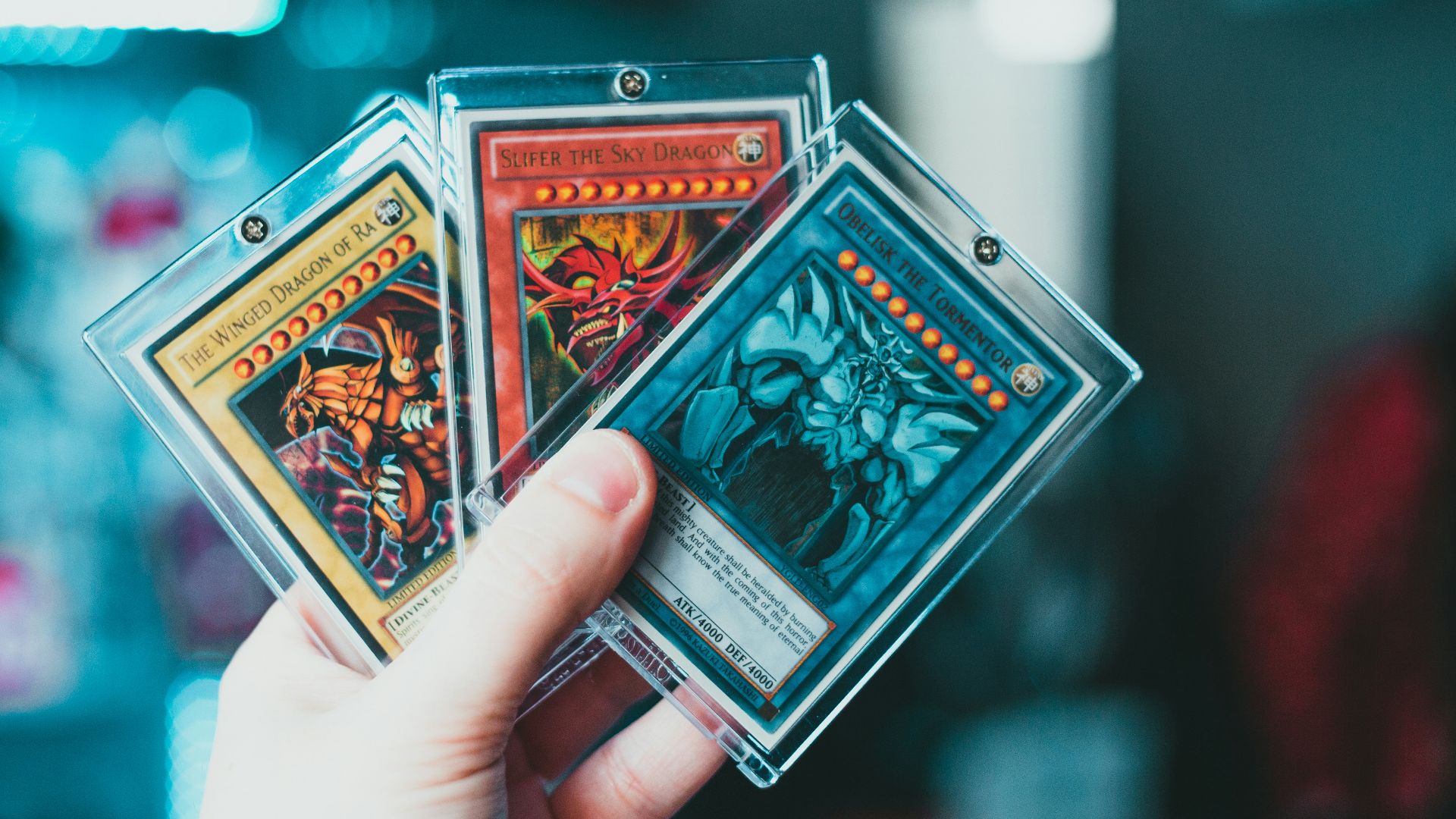 person holding yu gi oh trading card