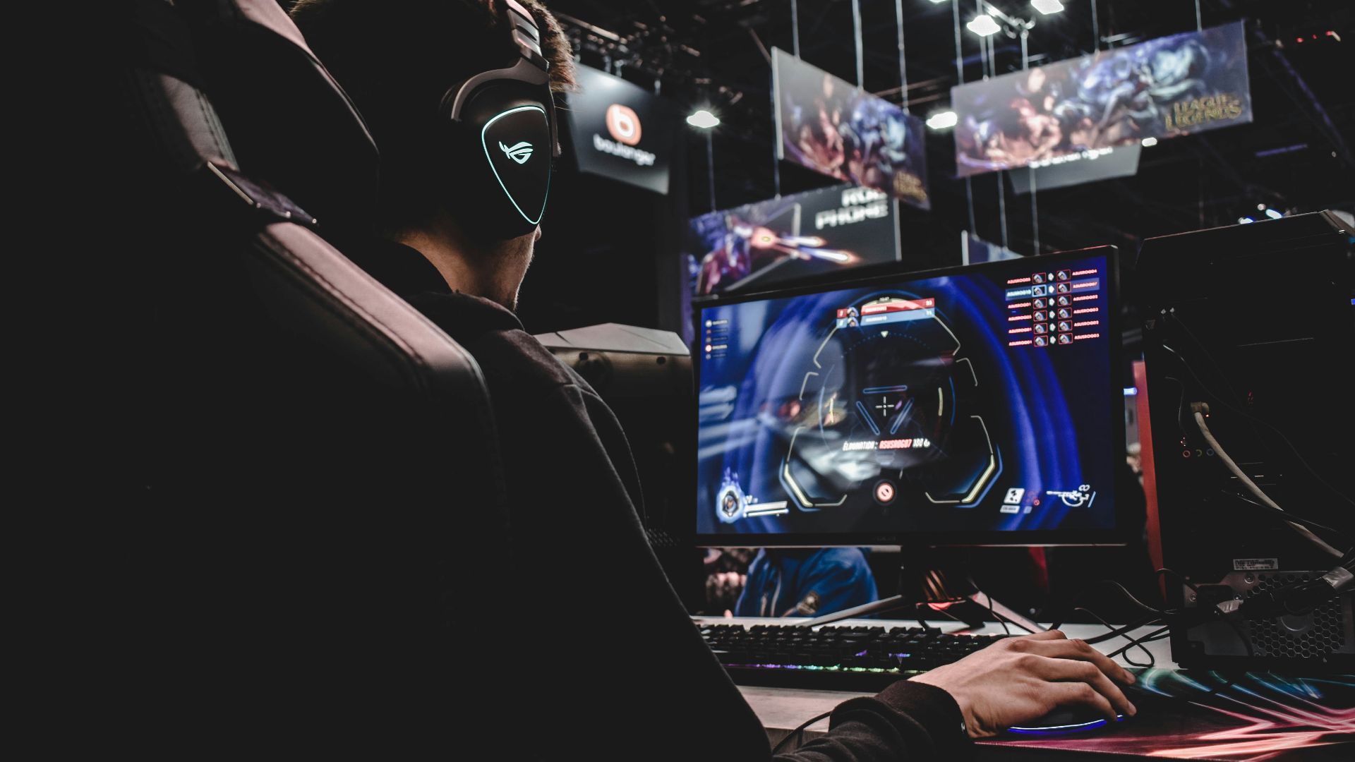 person sitting on gaming chair while playing video game