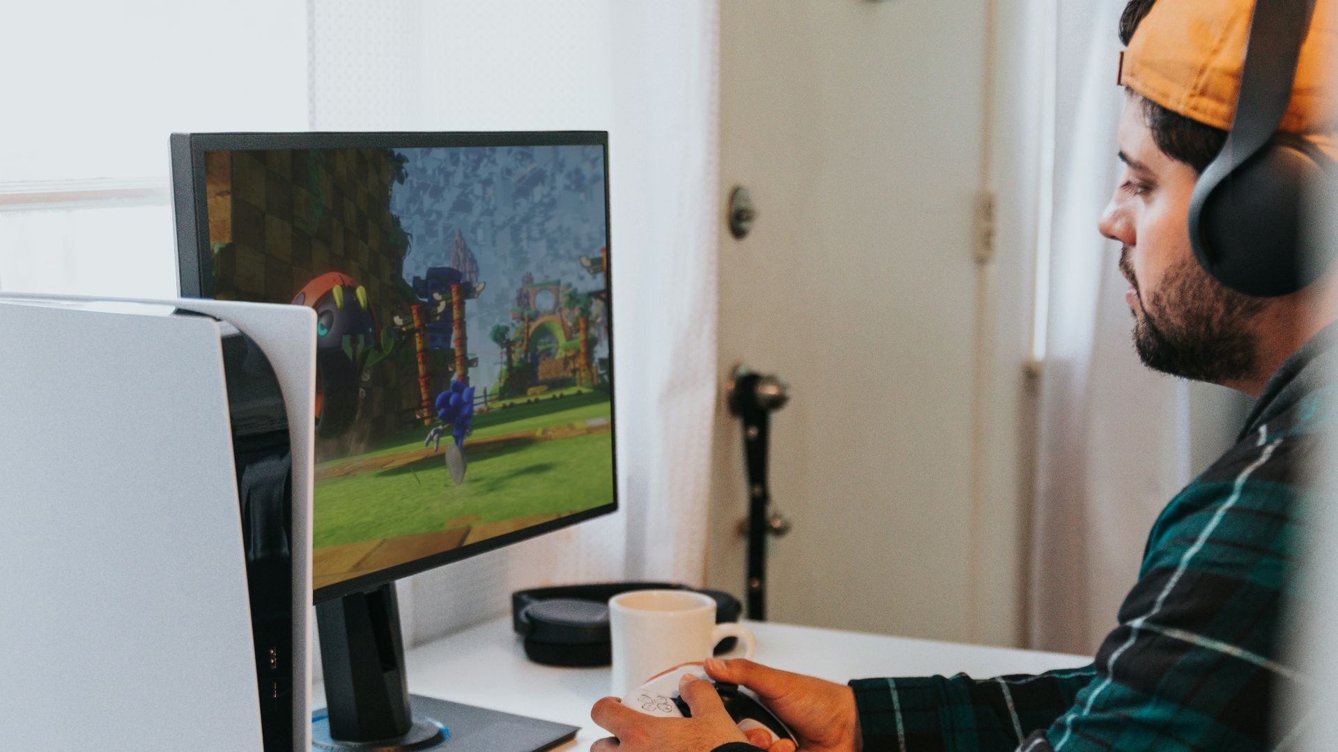 a person wearing a mask and sitting at a desk