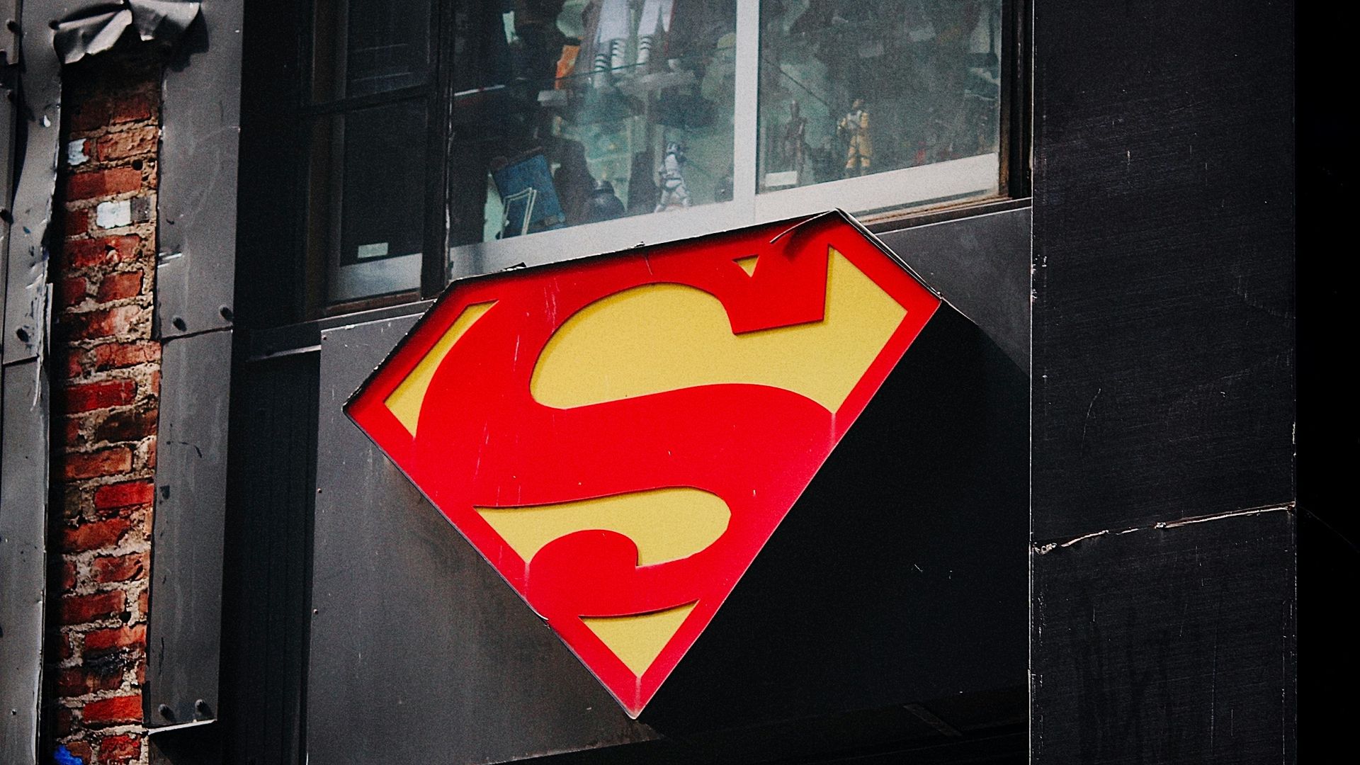 red and yellow heart sticker on black wooden door