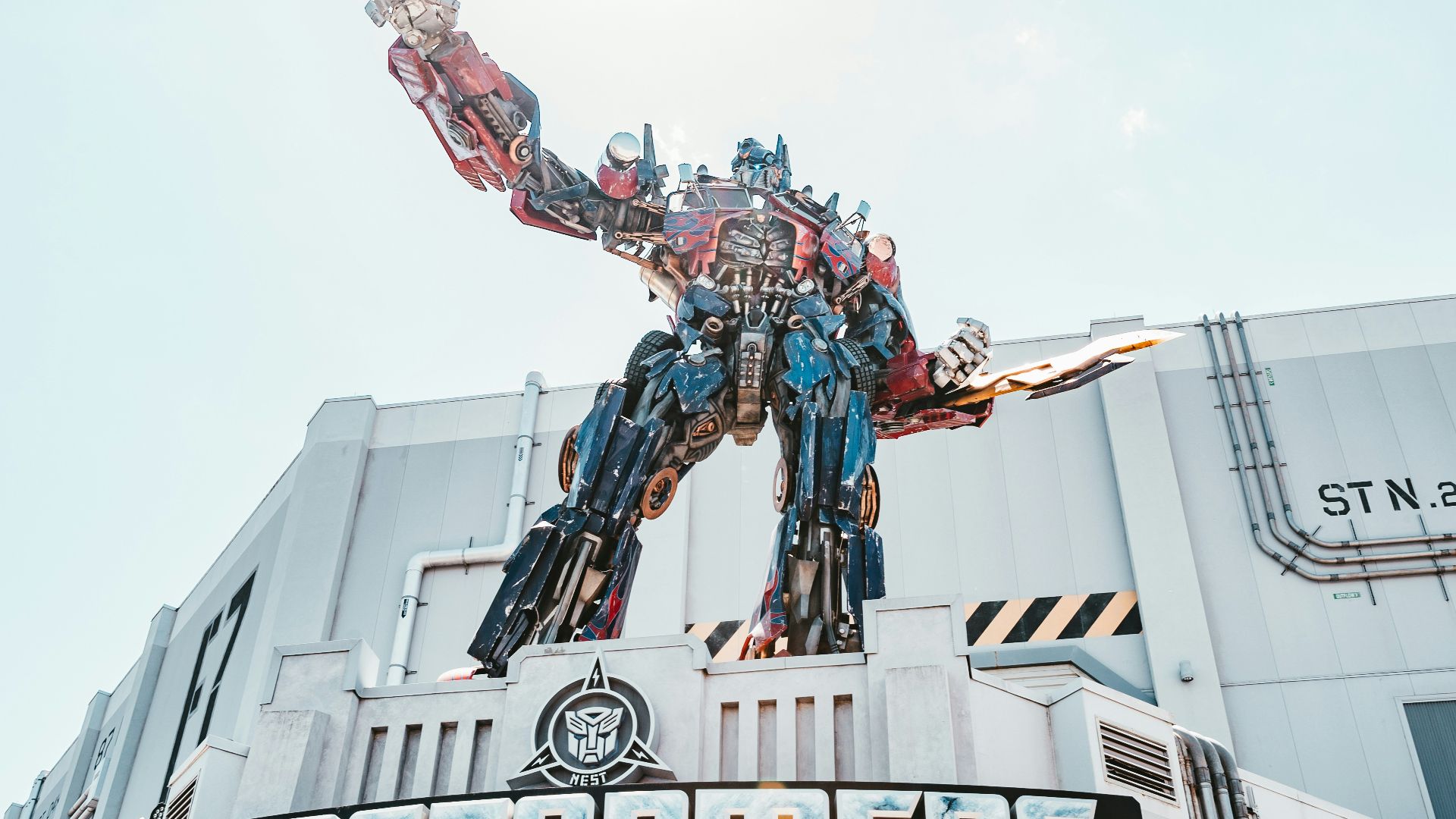 man in red and black suit statue