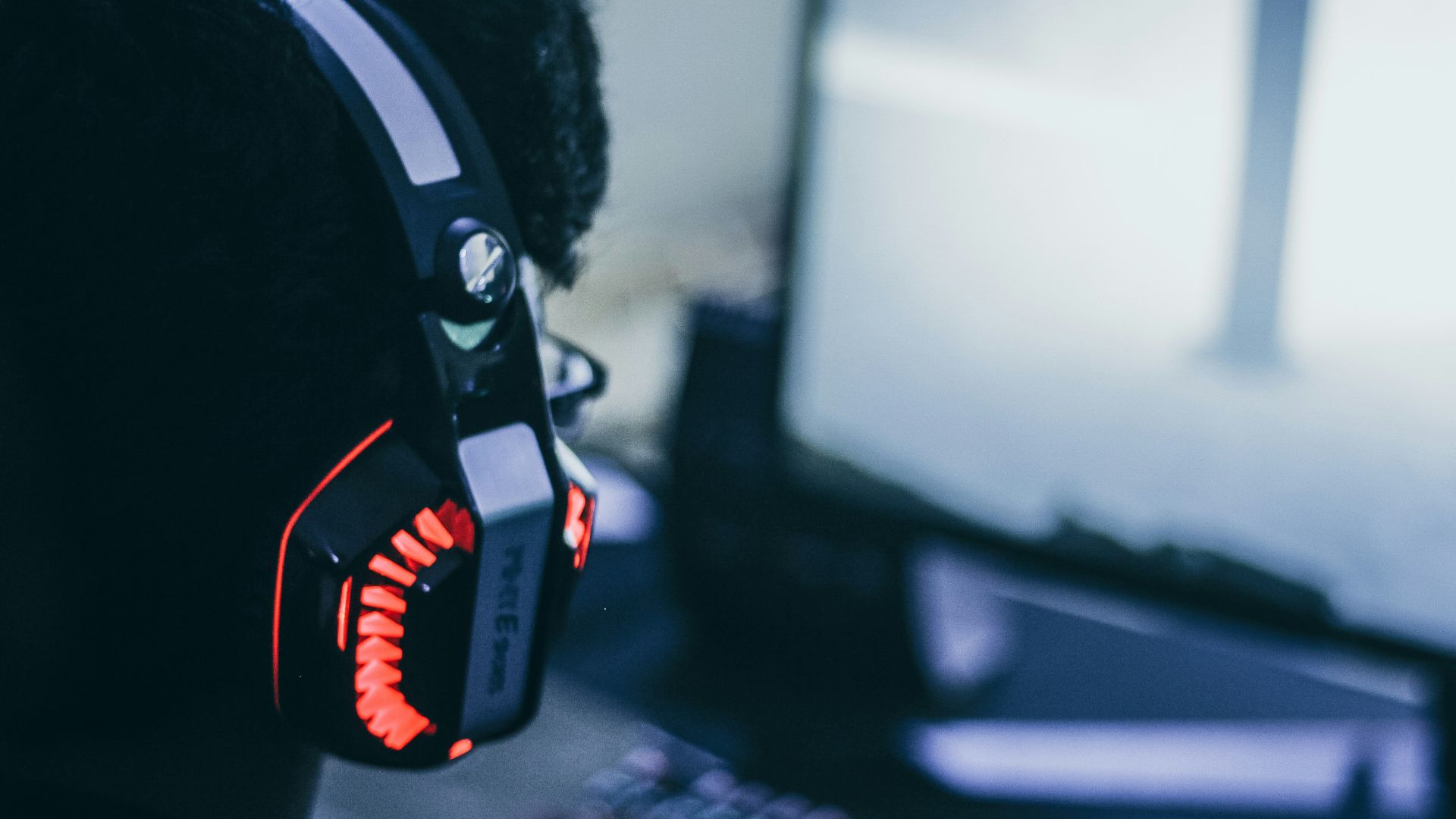 person wearing orange and black headphones