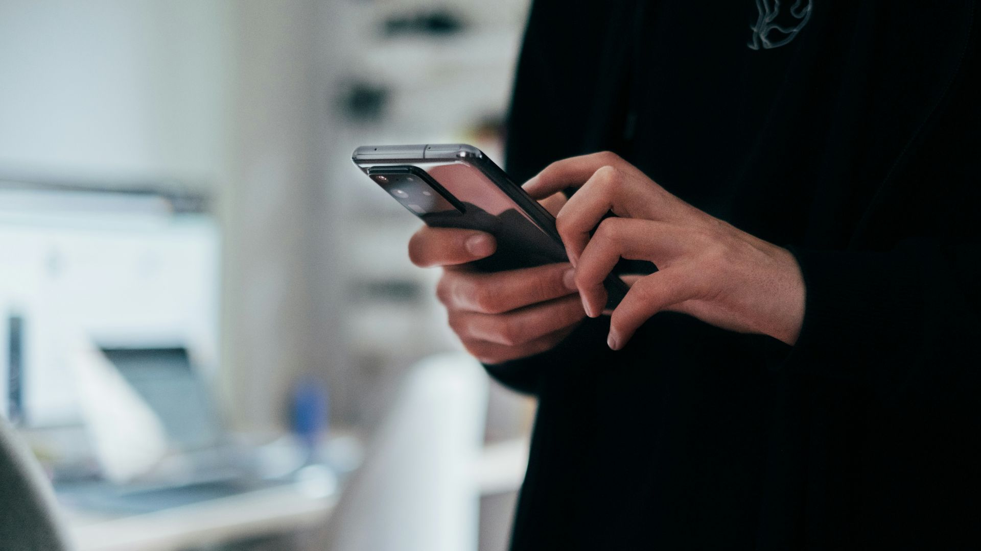 person holding black android smartphone