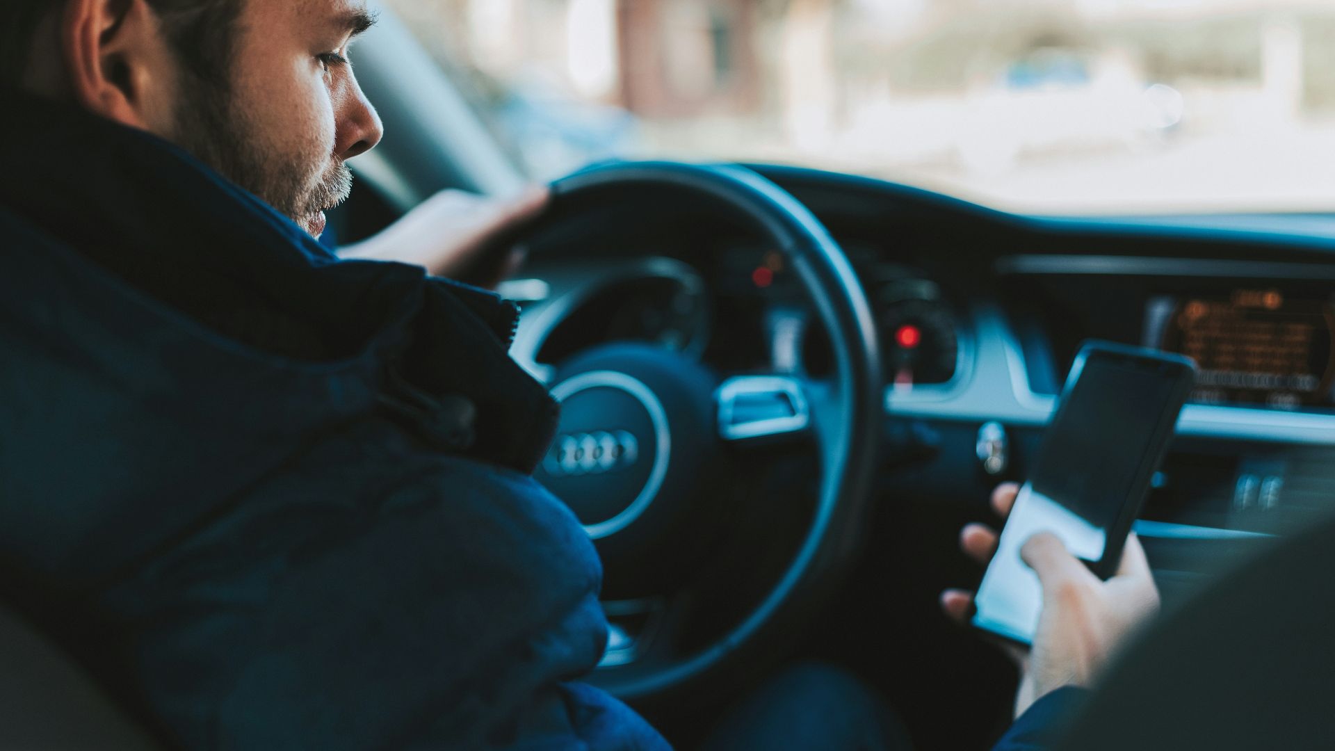 man holding black smartphone