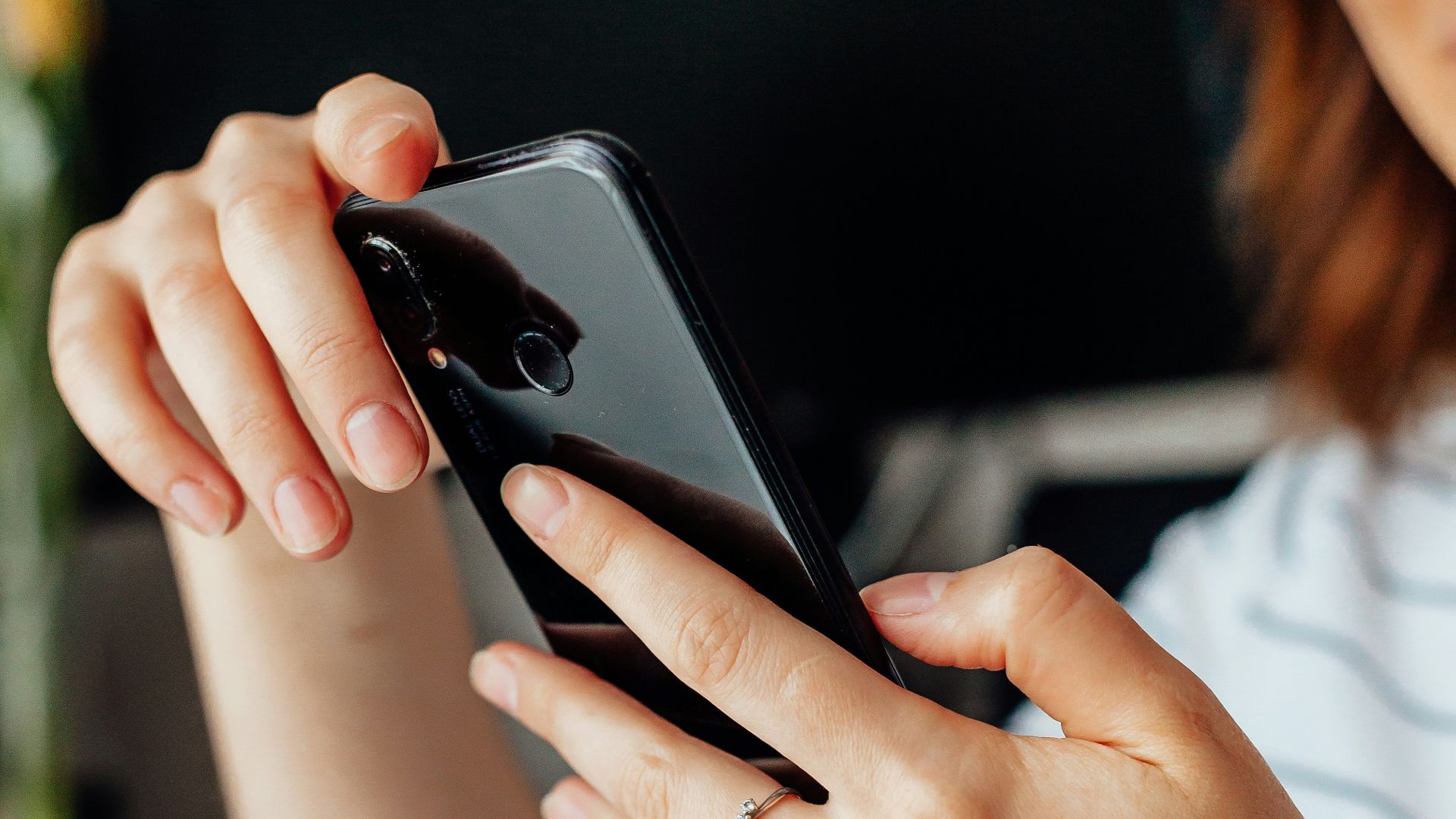 a close up of a person holding a cell phone