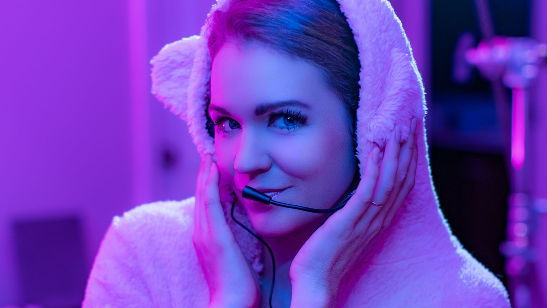 woman in white bathrobe covering her face with white towel