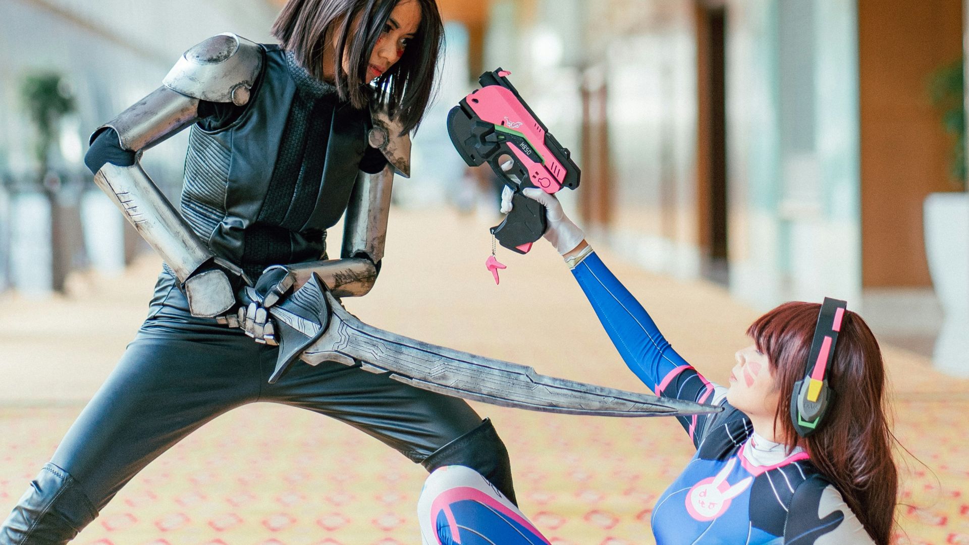 woman pointing sword to another woman