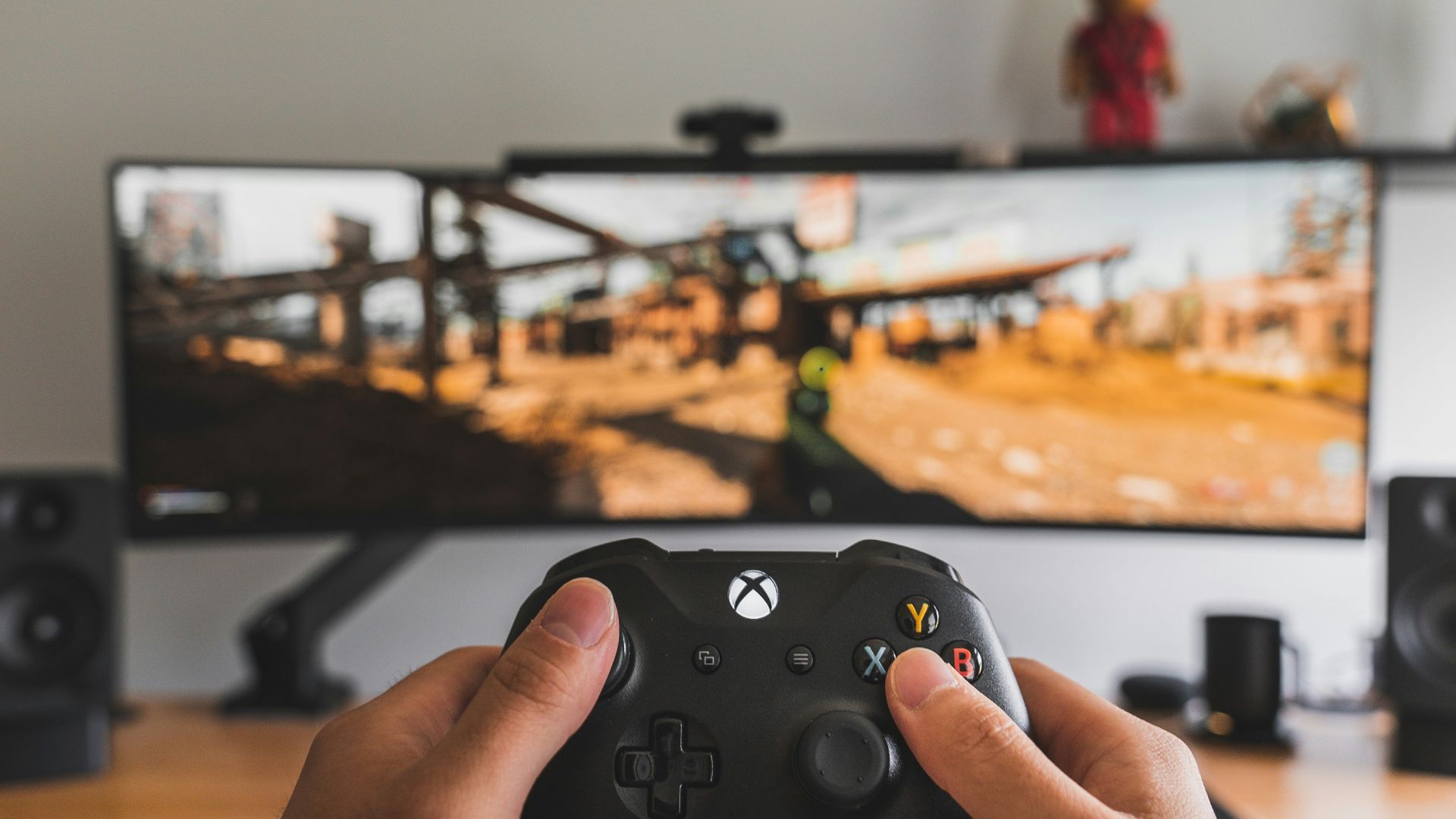 person holding black game controller