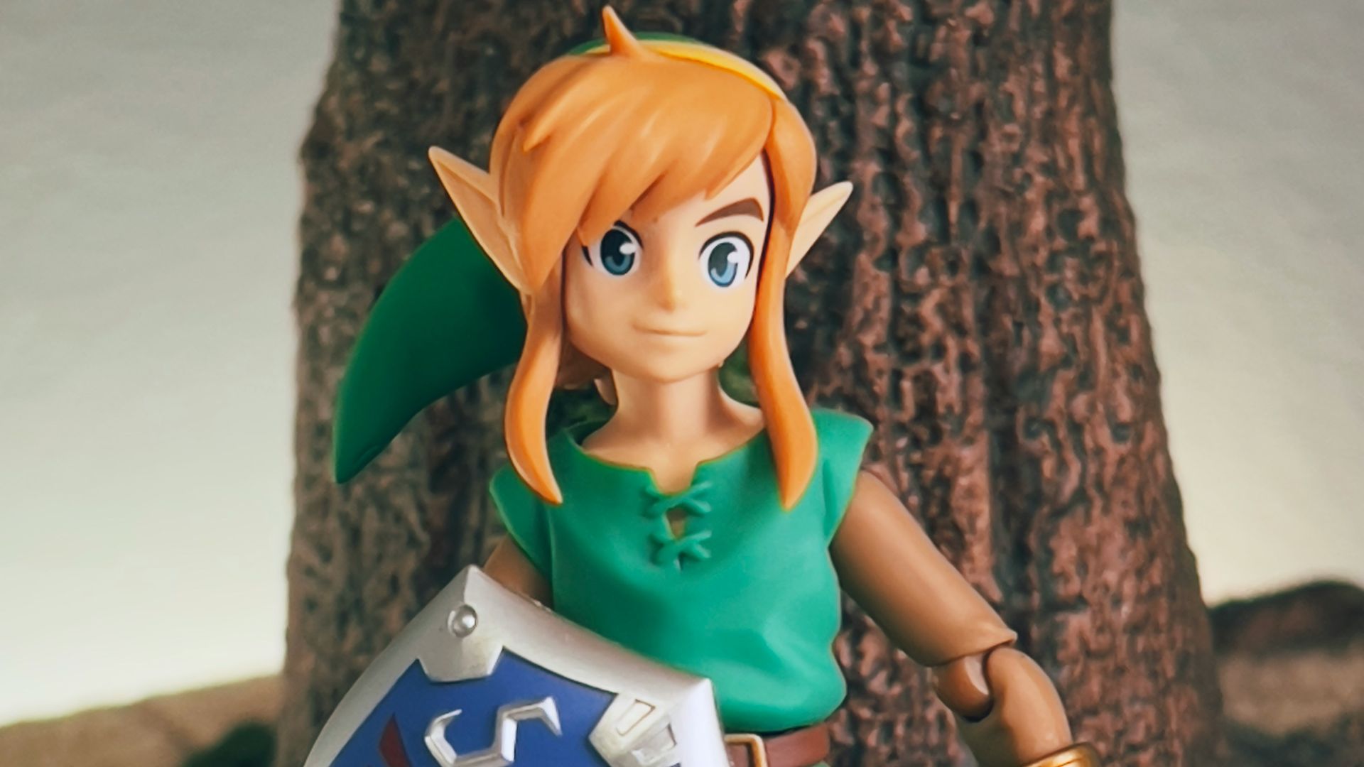 a toy girl holding a sign