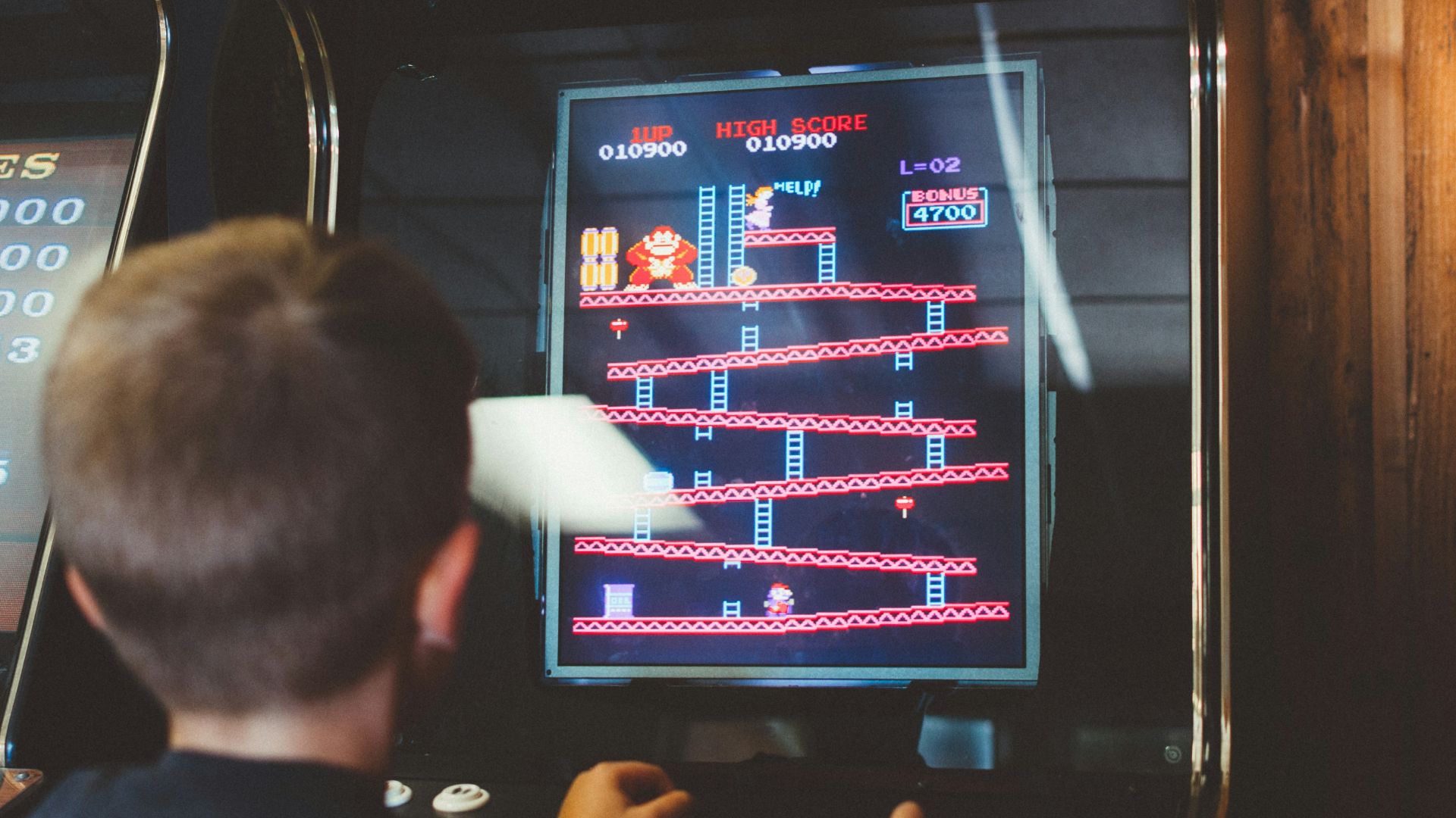boy playing donkey kong arcade box