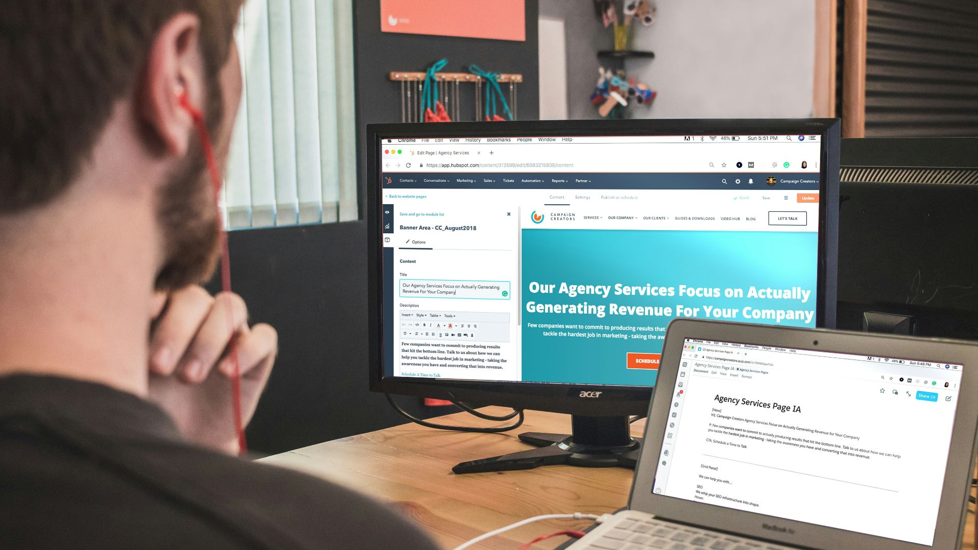 man sitting on chair using silver laptop