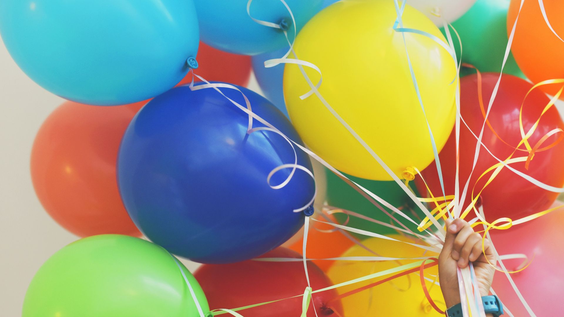 person holding balloons