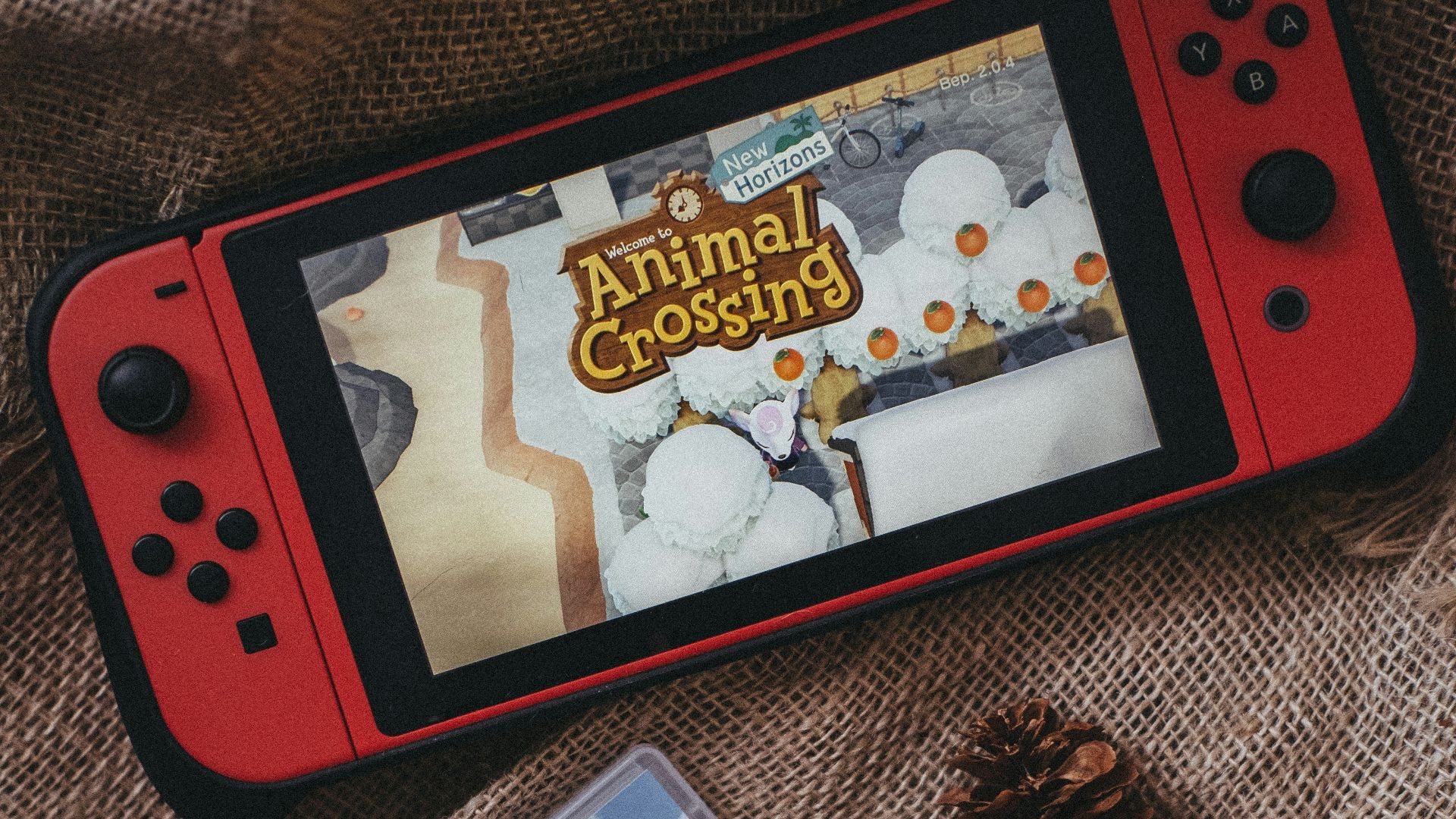 a nintendo wii game sitting on top of a blanket