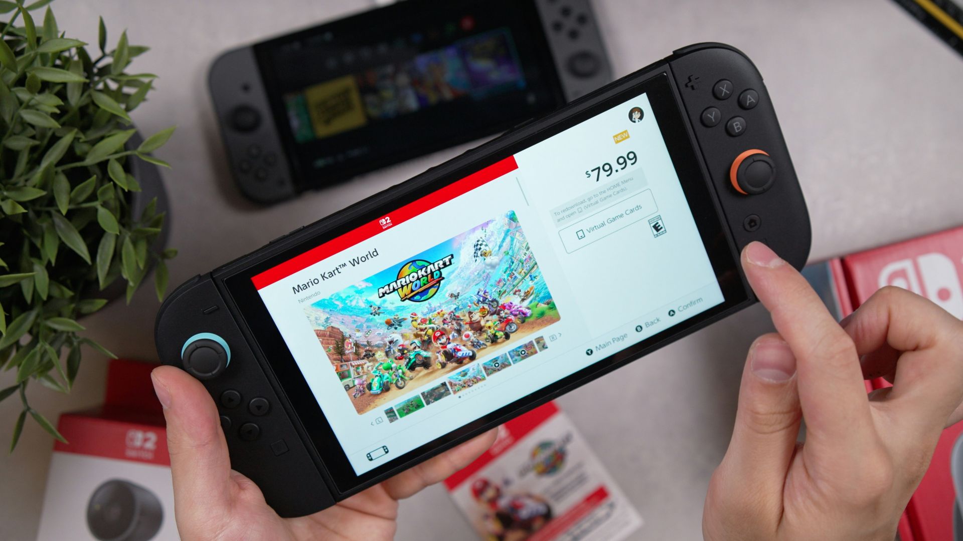 A hand is holding a nintendo switch handheld.