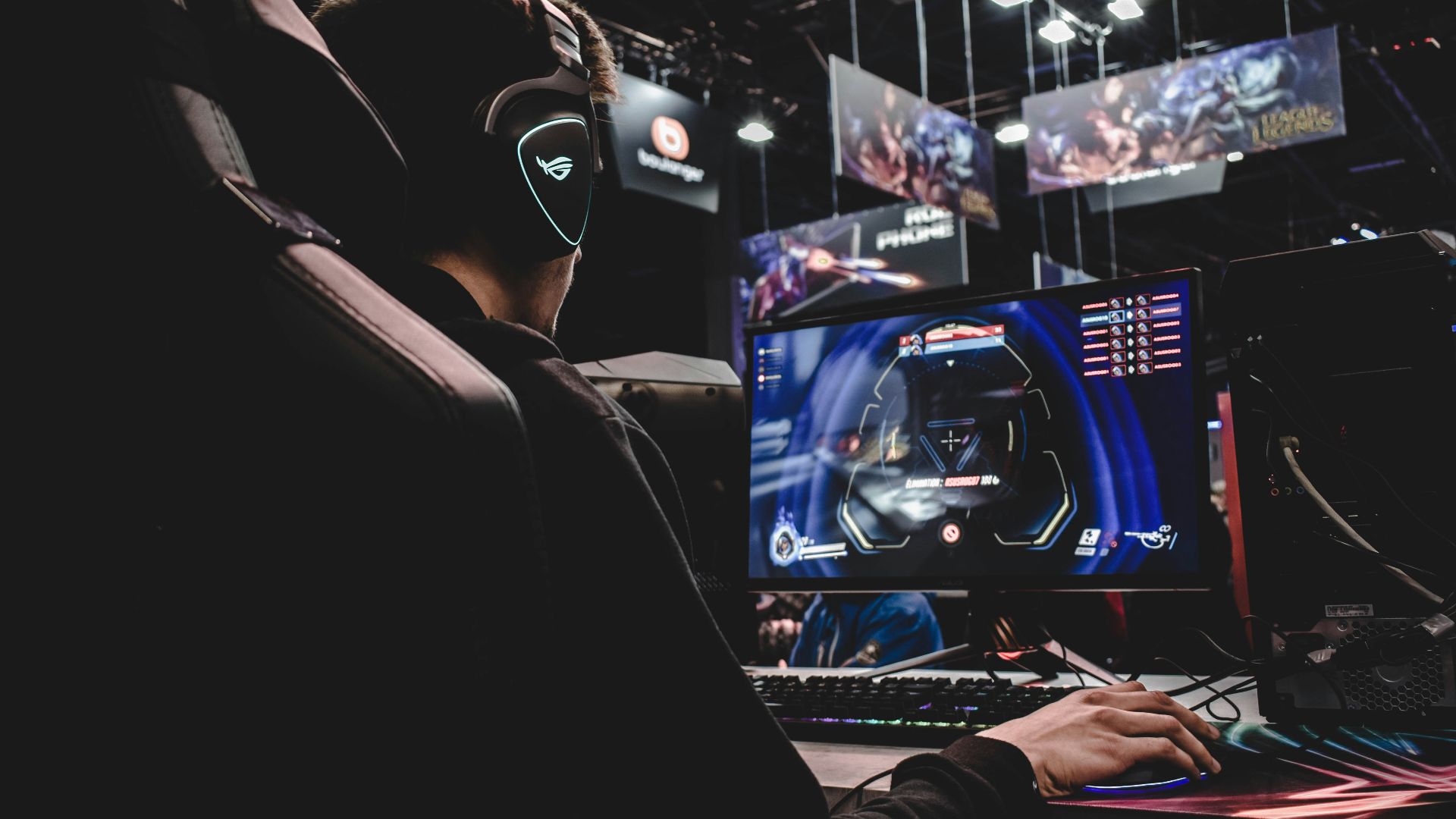 person sitting on gaming chair while playing video game