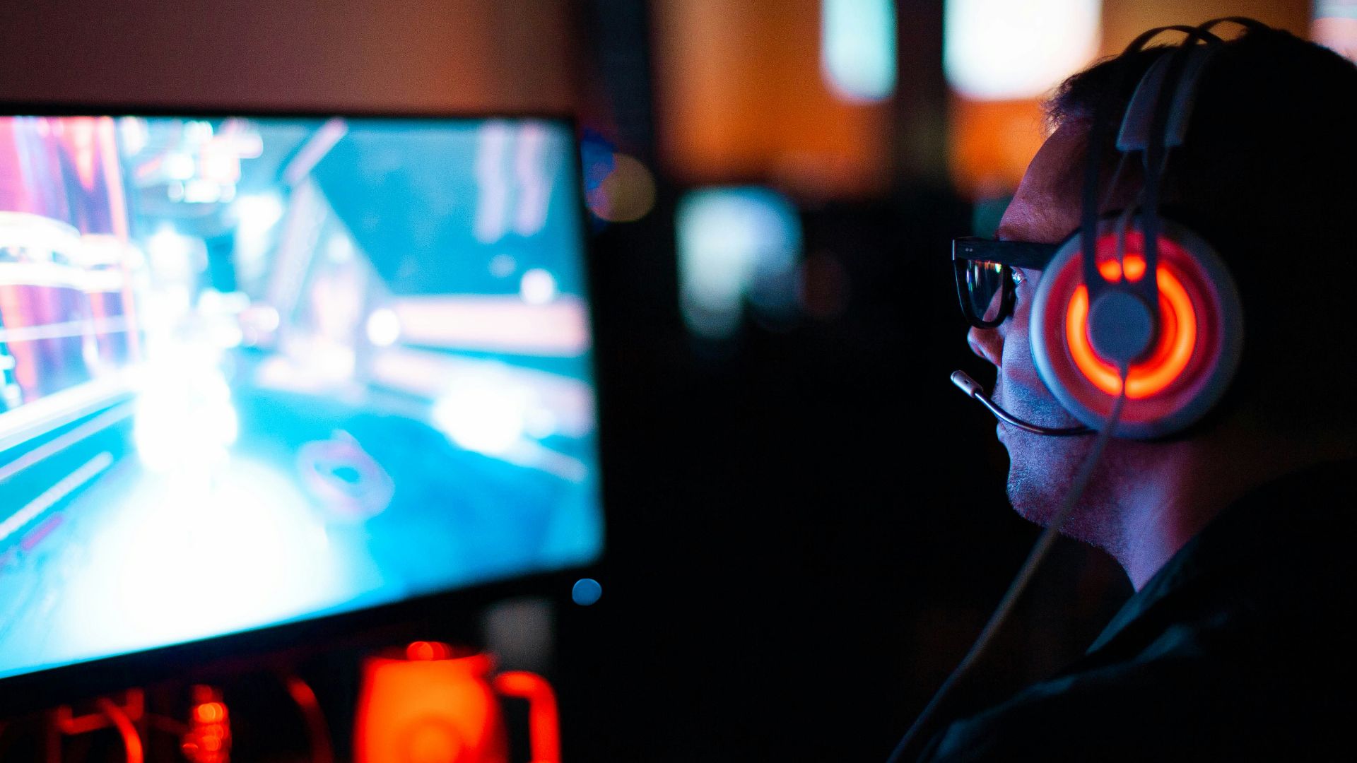 person using computer playing FPS game