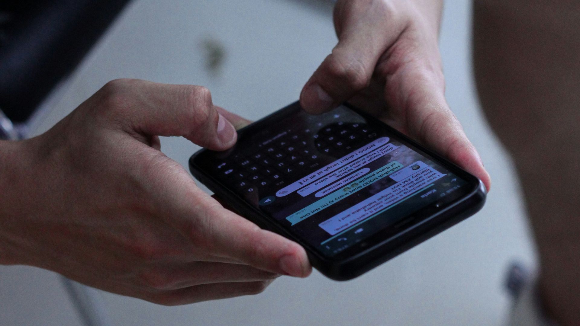 person holding black iphone 4