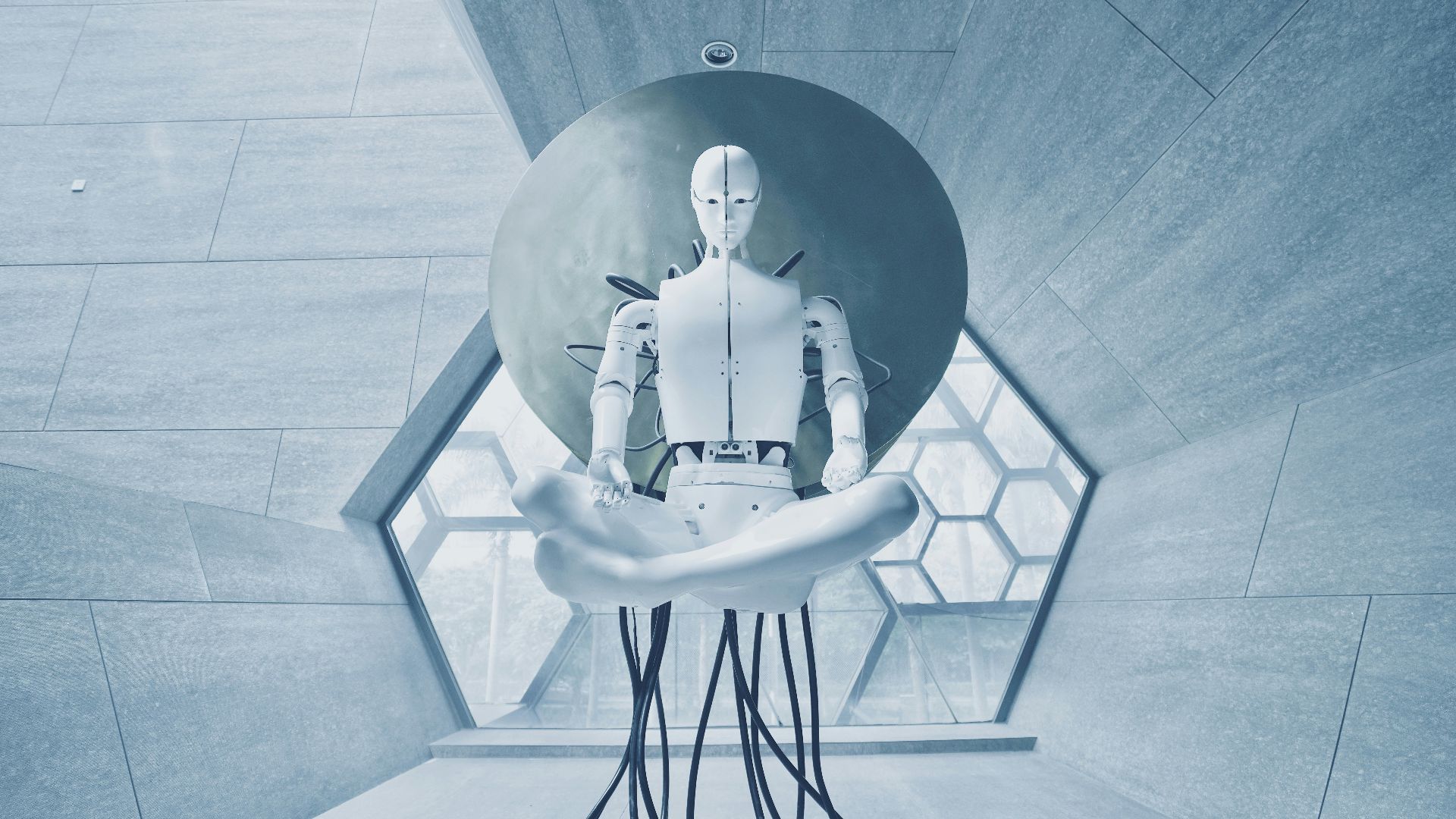 man in black jacket sitting on white chair