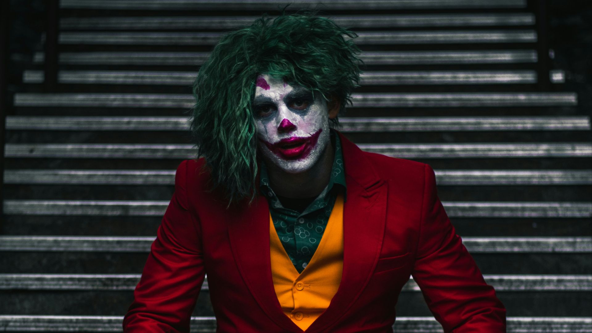 Joker sitting on stairs