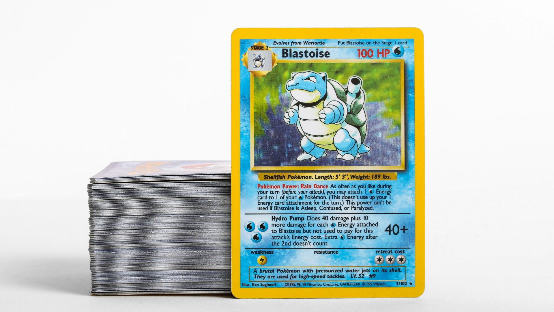 a stack of pokemon cards sitting on top of each other