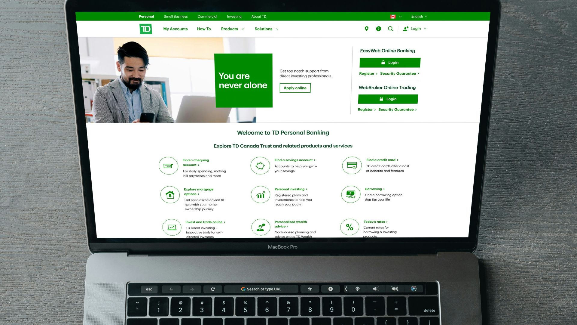 a person typing on a laptop with their hands