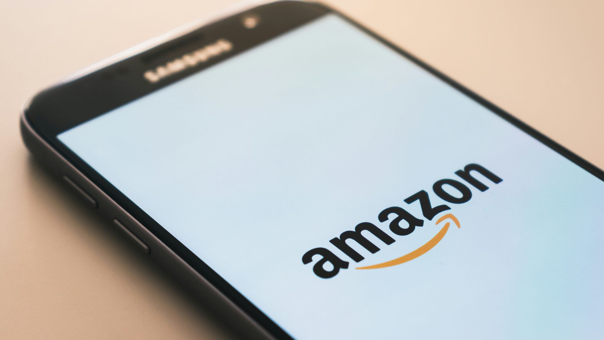 black Samsung Galaxy smartphone displaying Amazon logo