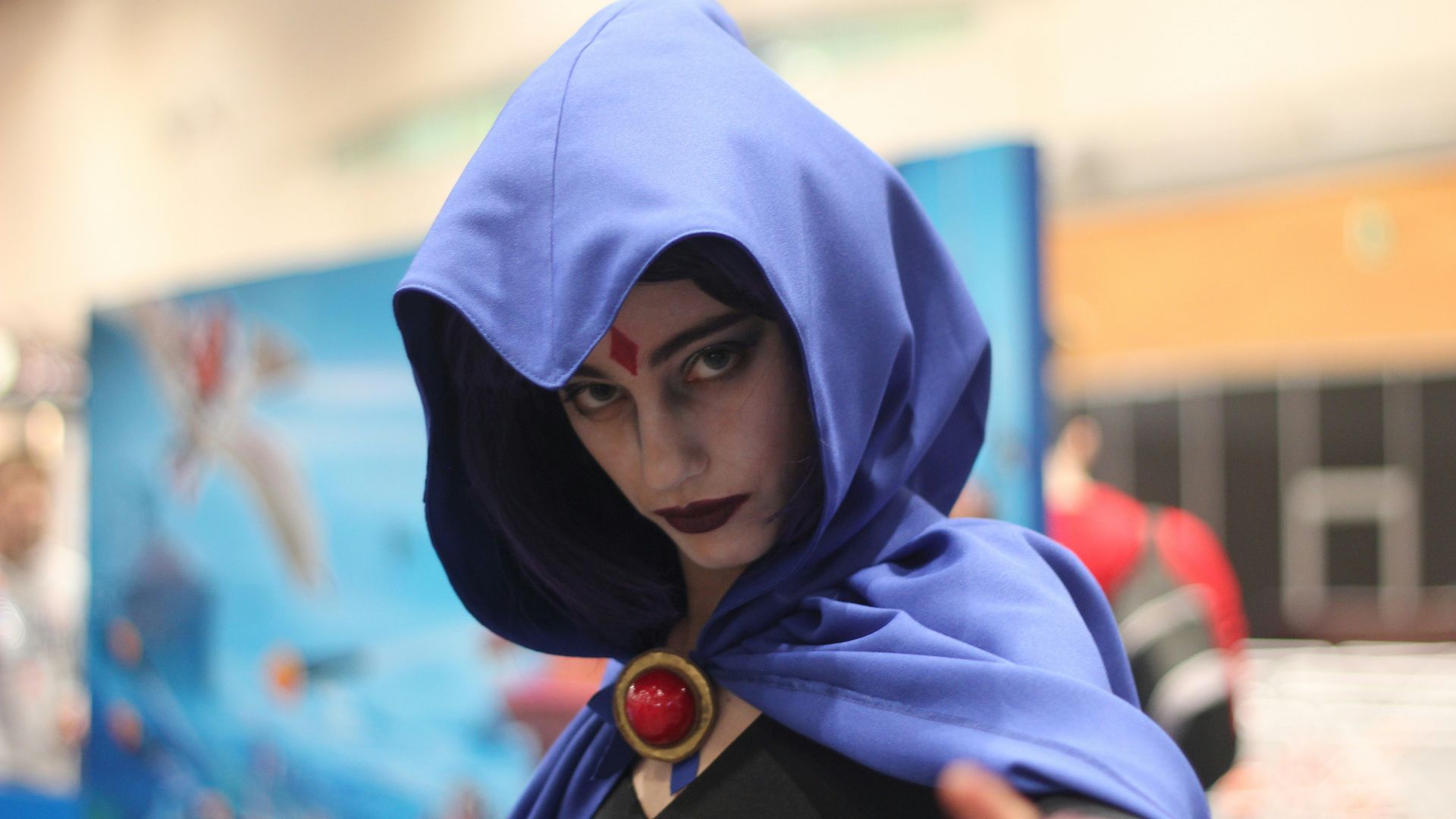 woman wearing DC Raven costume indoors